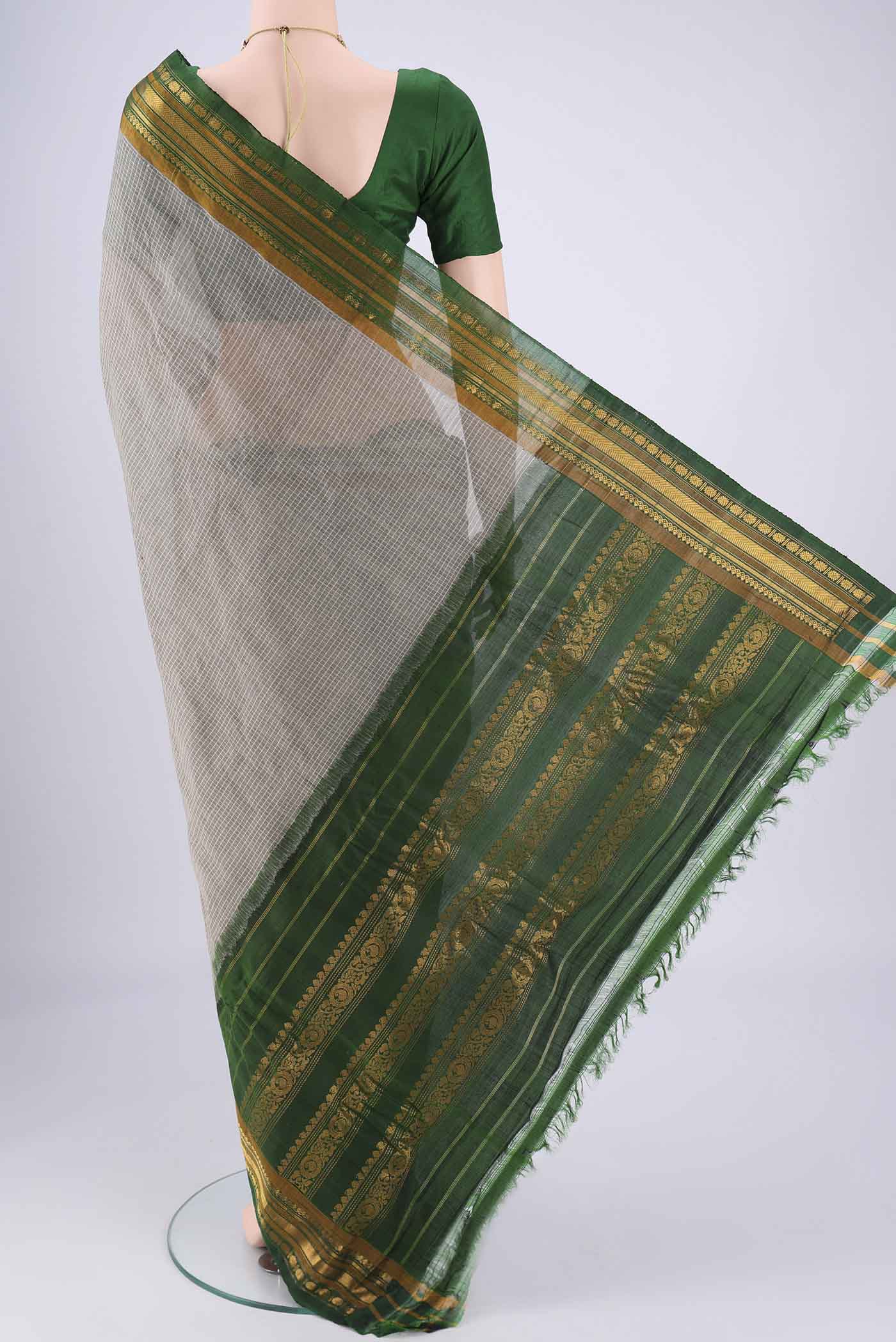 Flat view of Grey Gadwal cotton Saree with Checked design on the body and Zari Border. 