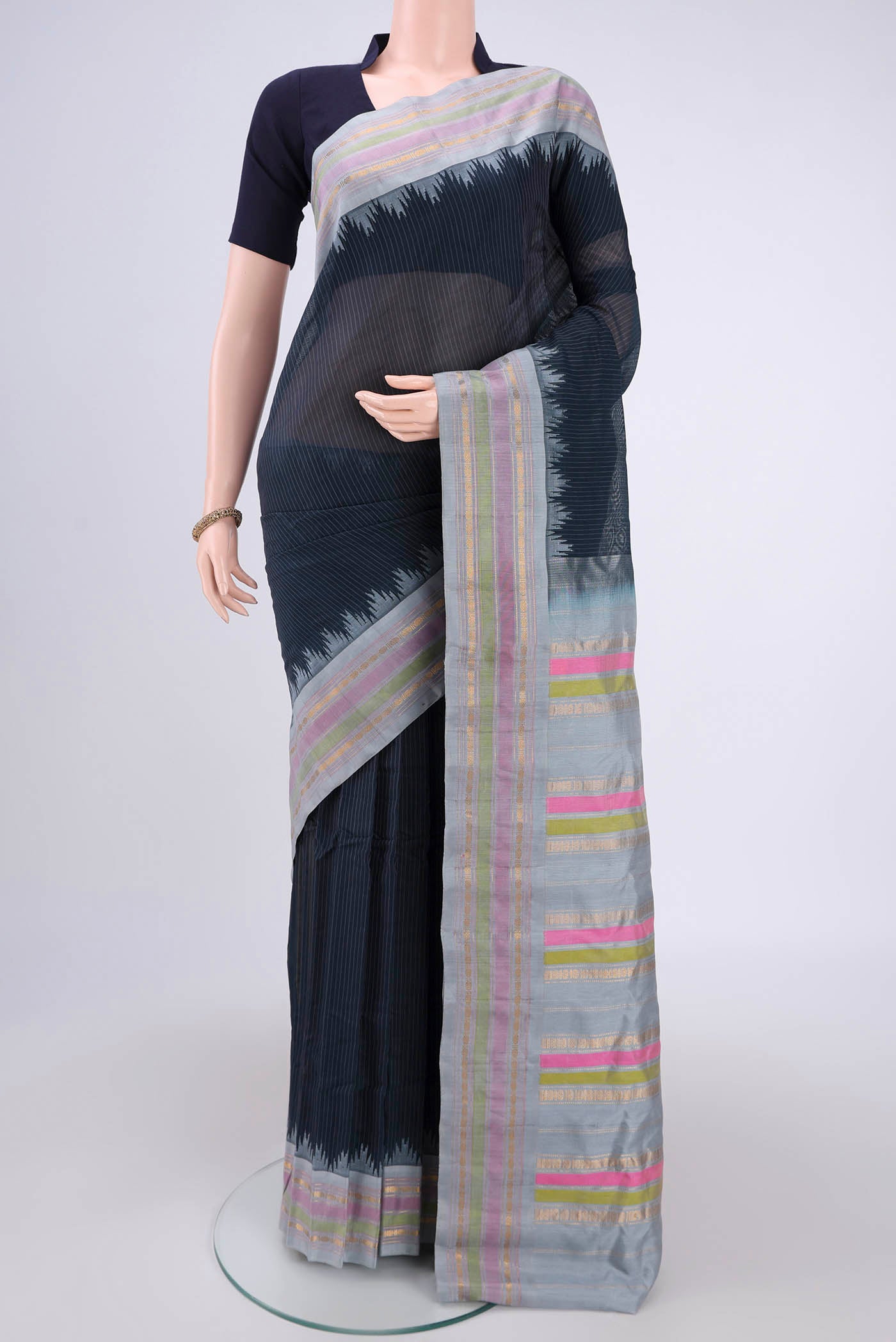 Davys Grey Gadwal Silk Saree with Stripes on the body and Zari Border.  displayed on a mannequin