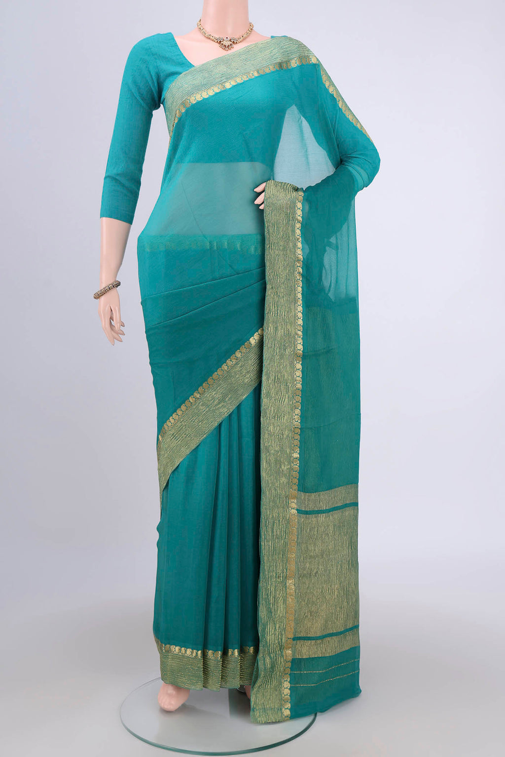 Sea Green Mysore Chiffon Saree with Plain Body and Zari Border.  displayed on a mannequin