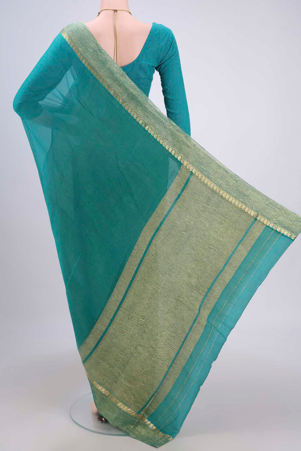 Flat view of Sea Green Mysore Chiffon Saree with Plain Body and Zari Border. 