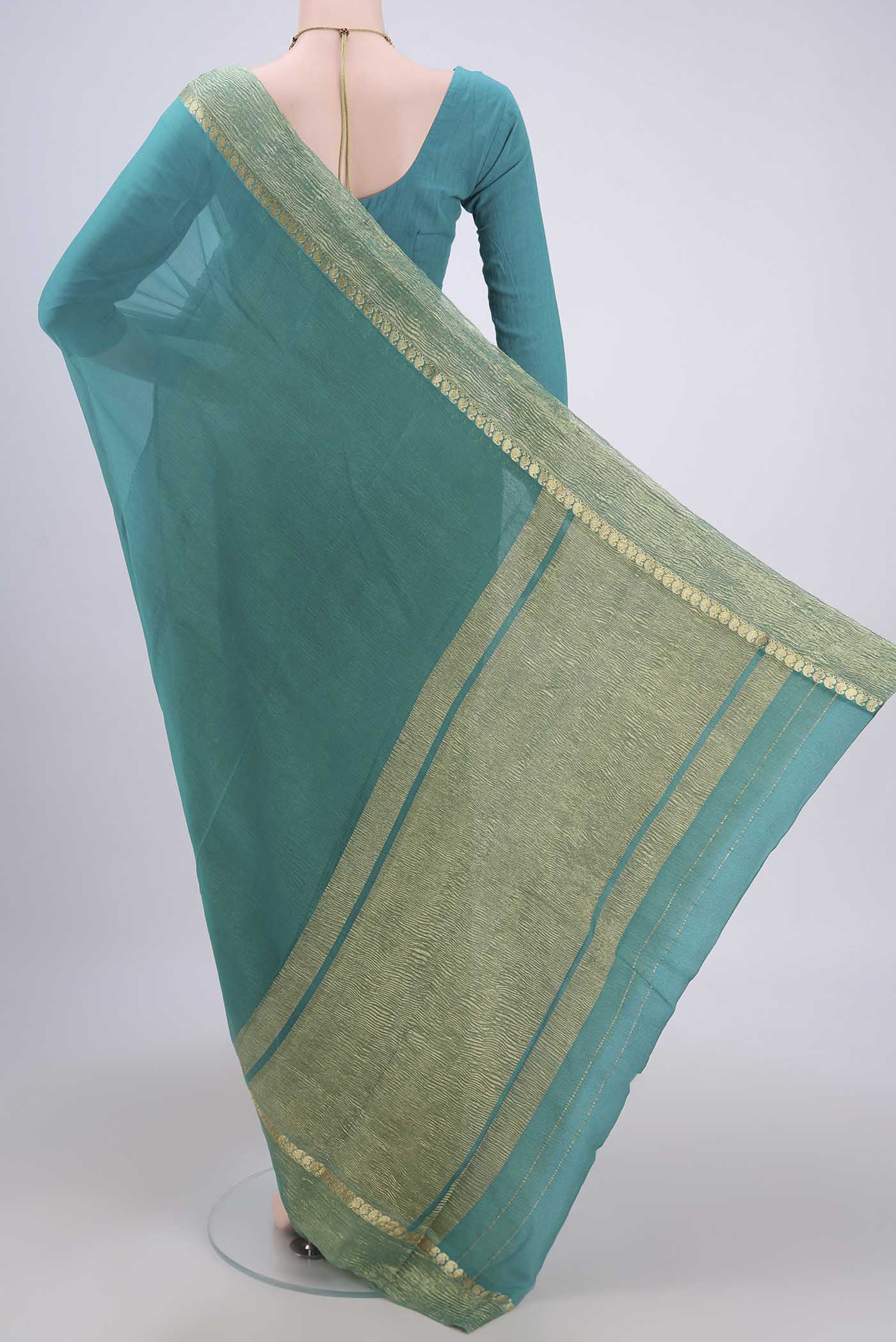 Flat view of Sea Green Mysore Chiffon Saree with Plain Body and Zari Border. 