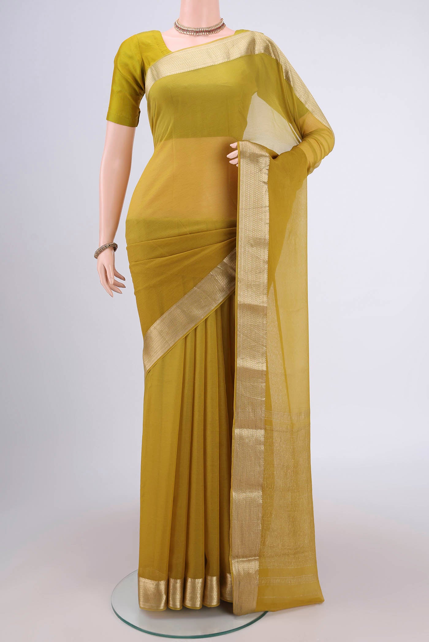 Mustard Mysore Chiffon Saree with Plain Body and Satin Border.  displayed on a mannequin