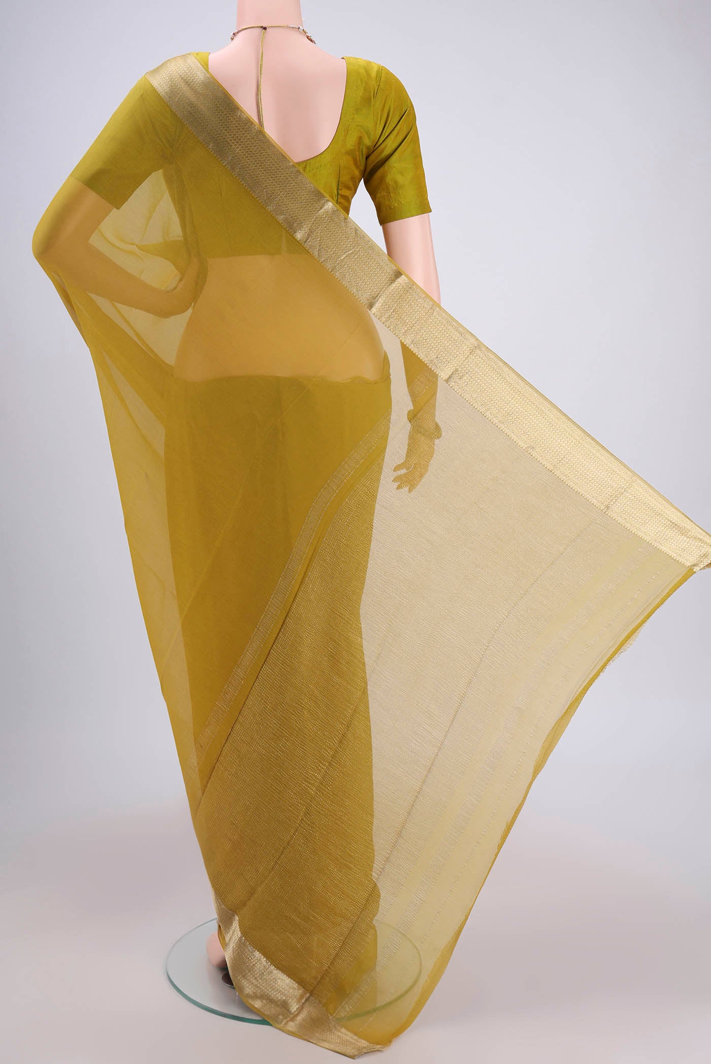 Flat view of Mustard Mysore Chiffon Saree with Plain Body and Satin Border. 