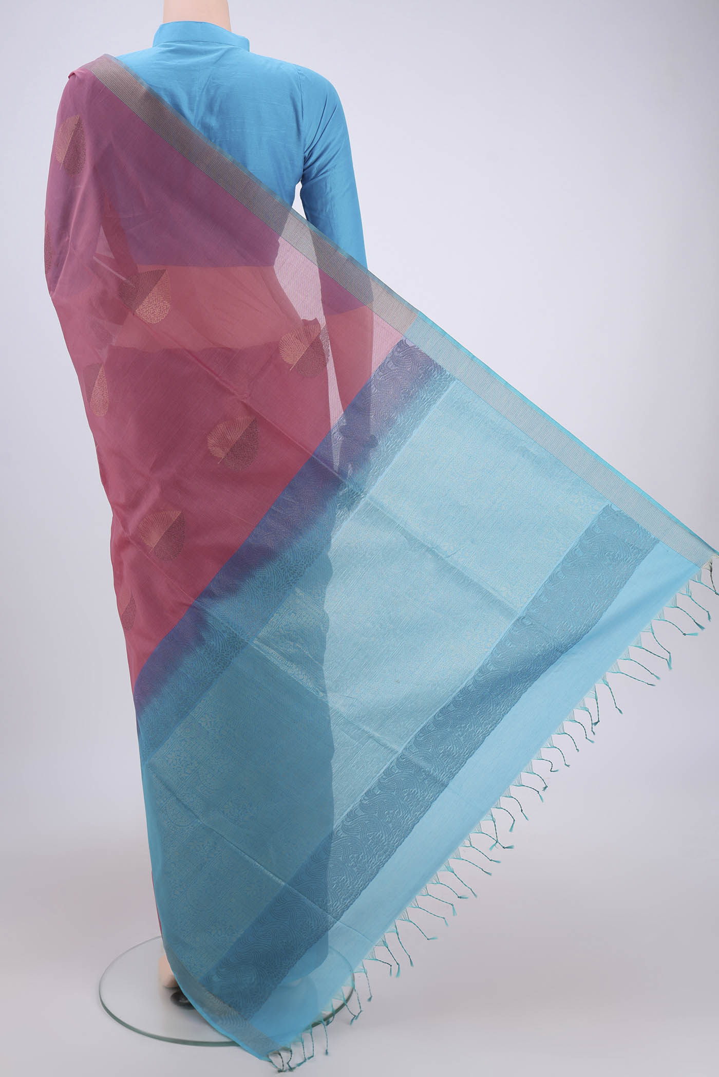 Flat view of Rose Gold Kora Cotton Saree with Zari Butta on the body and Plain Border. 