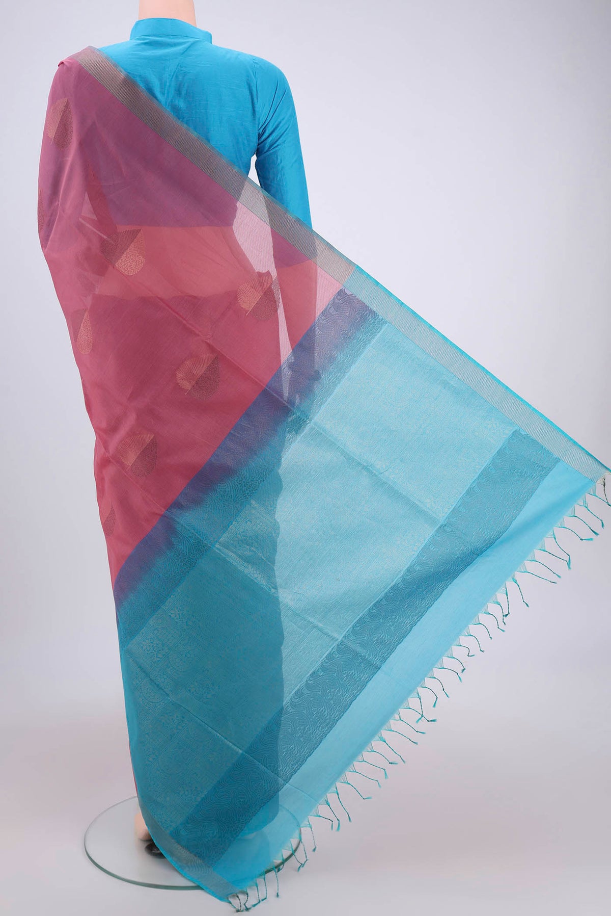 Flat view of Rose Gold Kora Cotton Saree with Zari Butta on the body and Plain Border. 
