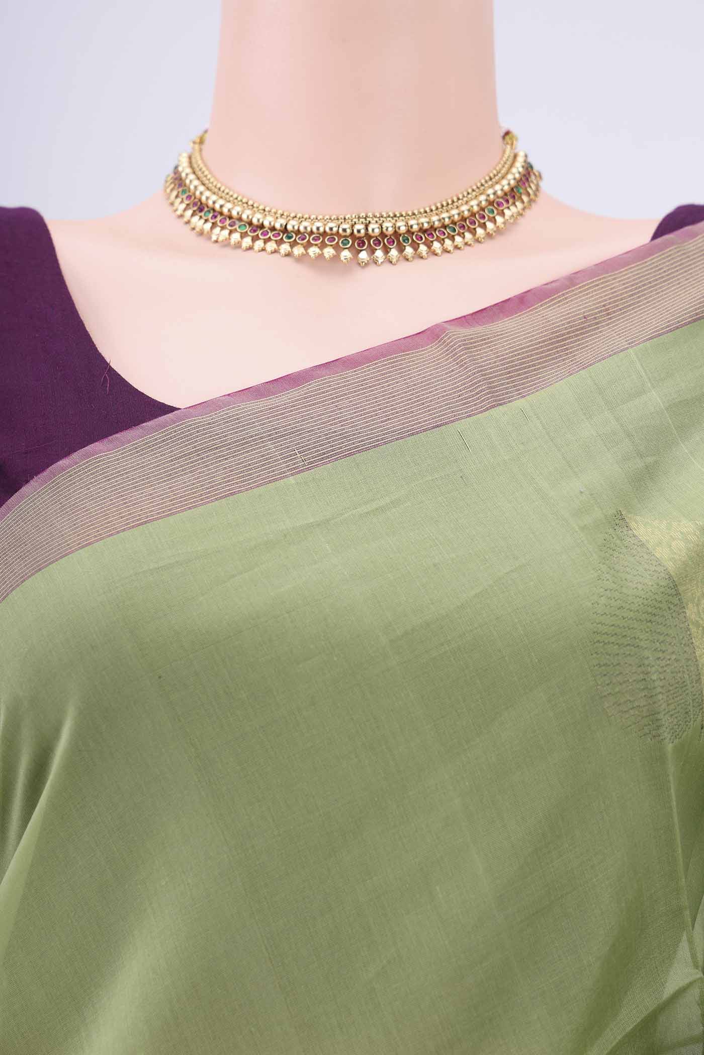 Border image of Light Green Silk Cotton Saree with Zari Butta on the body and Zari Border. 