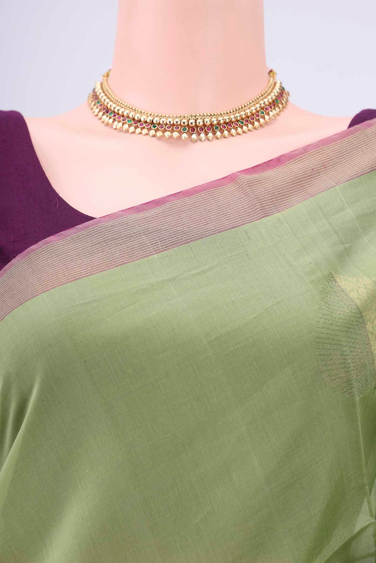 Border image of Light Green Silk Cotton Saree with Zari Butta on the body and Zari Border. 