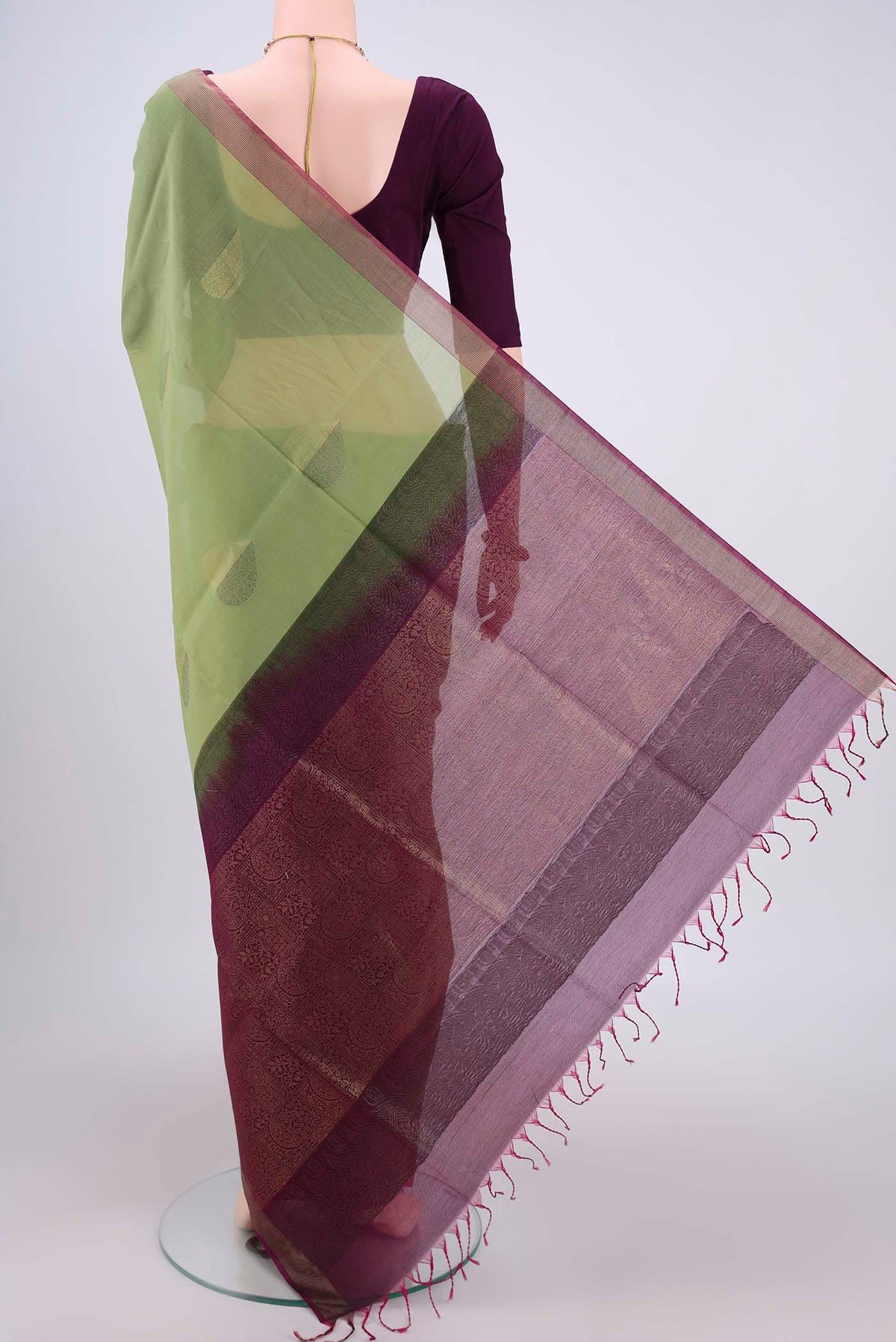 Flat view of Light Green Silk Cotton Saree with Zari Butta on the body and Zari Border. 