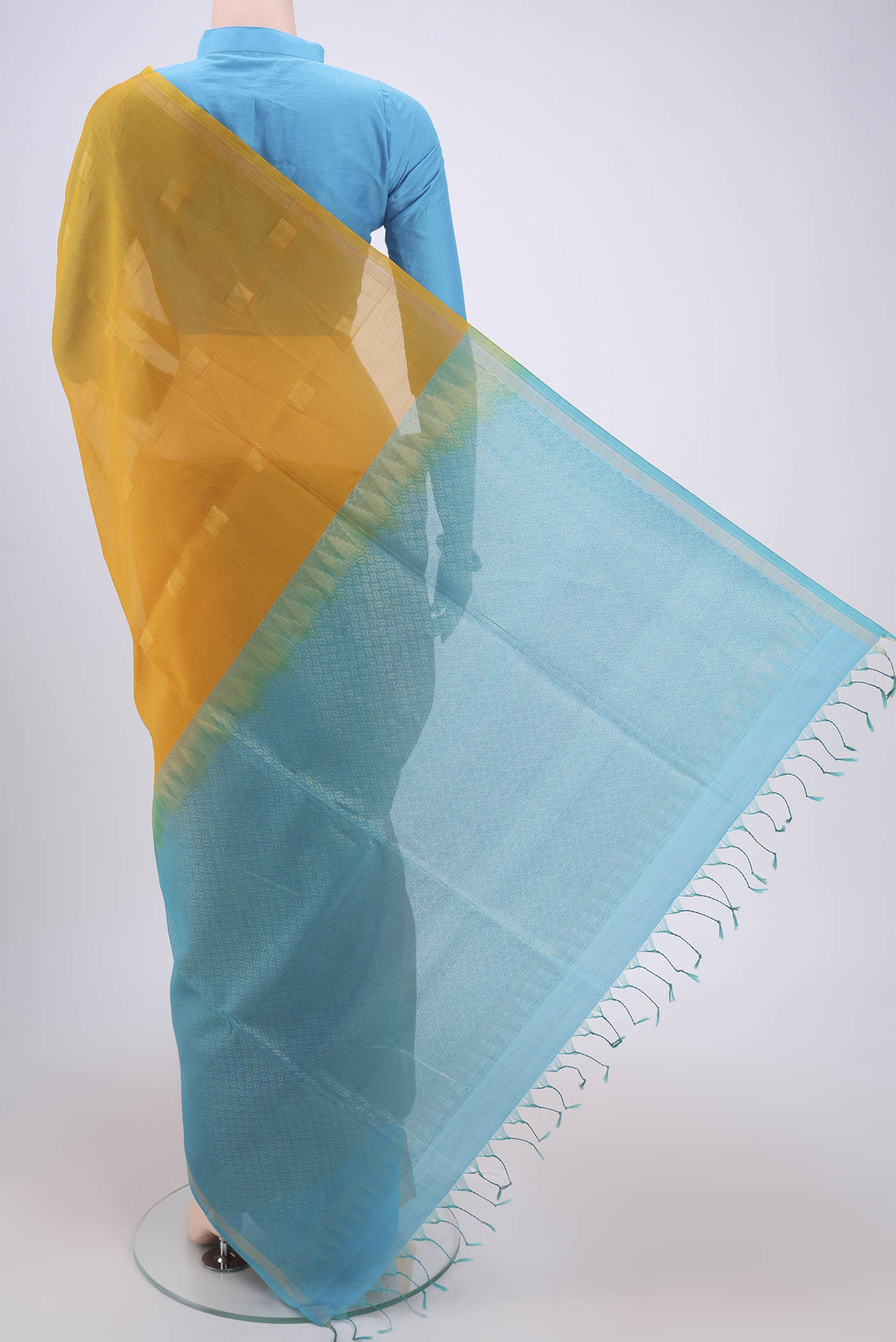 Flat view of Yellow Silk Cotton Saree with Zari Butta on the body and Thin Zari Line. 