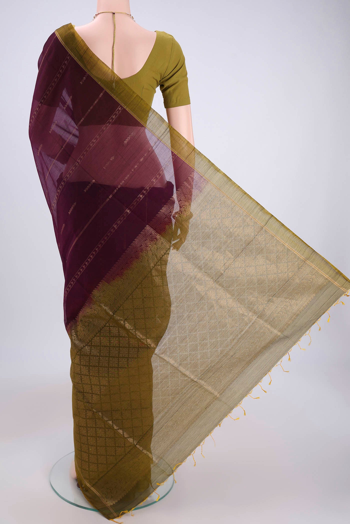 Flat view of Magenta Silk Cotton Saree with Zari Butta on the body and Zari Border. 