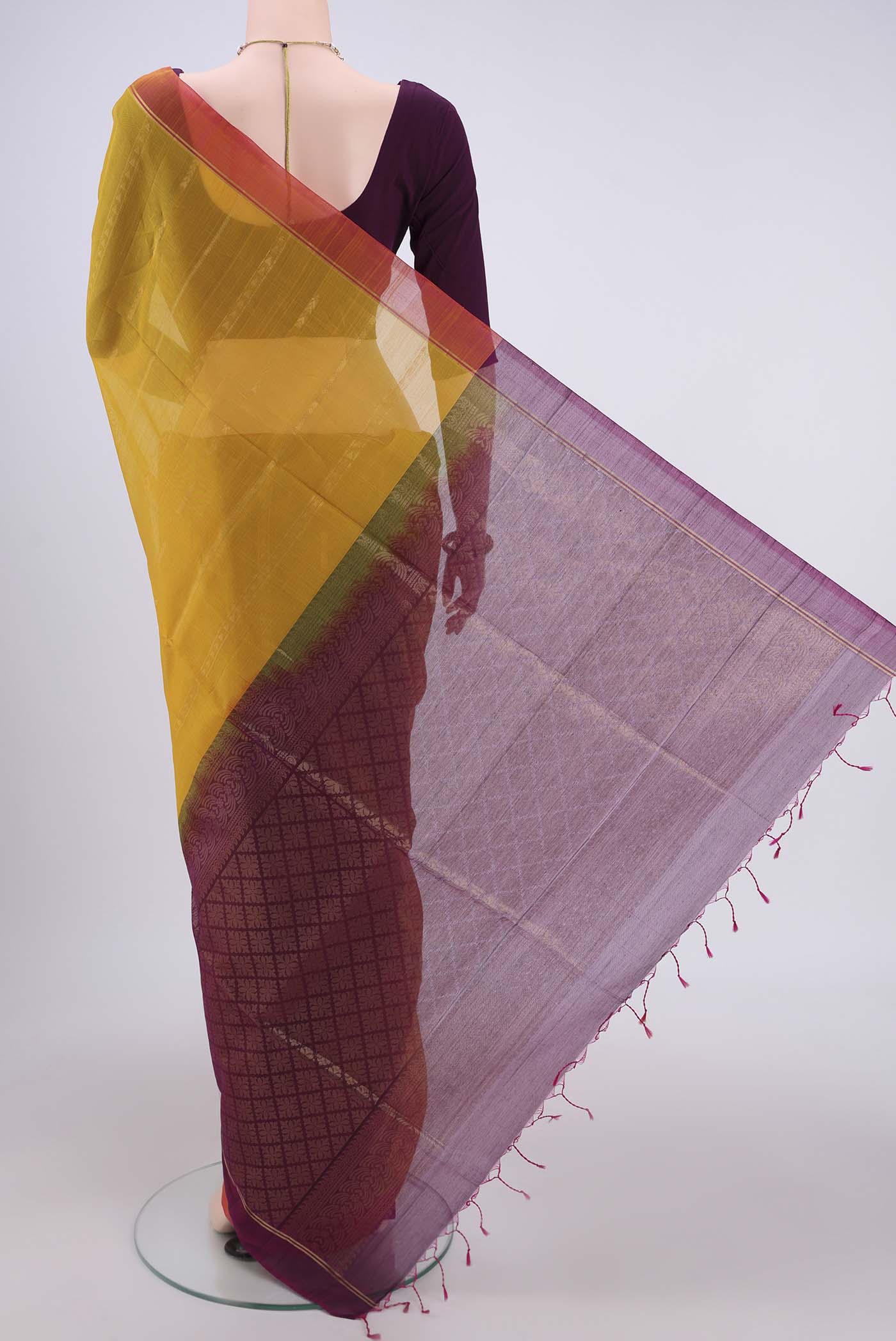 Flat view of Yellow Silk Cotton Saree with Zari Butta on the body and Zari Border. 