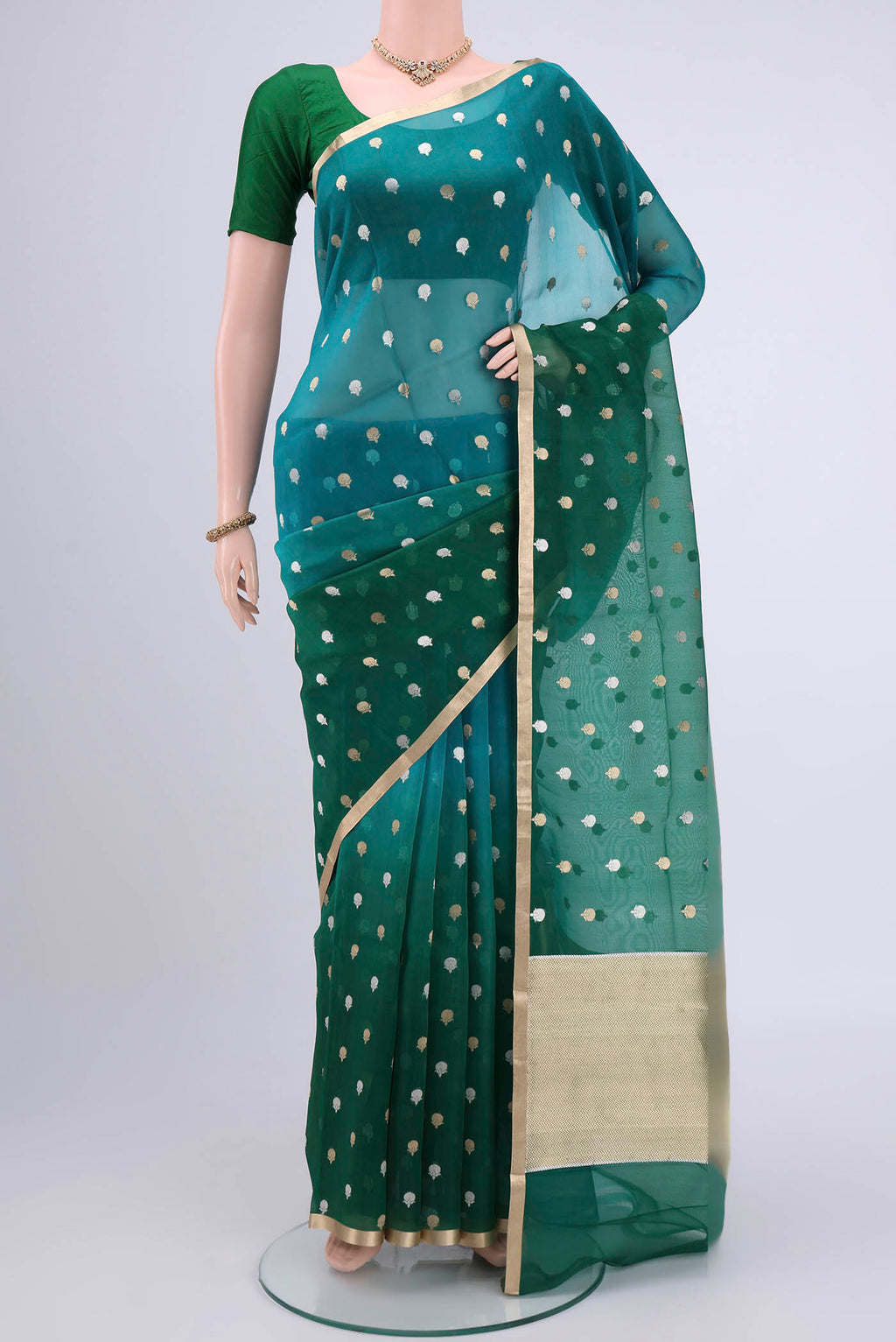 Blue Organza Silk Saree with Half And Half on the body and Zari Border.  displayed on a mannequin