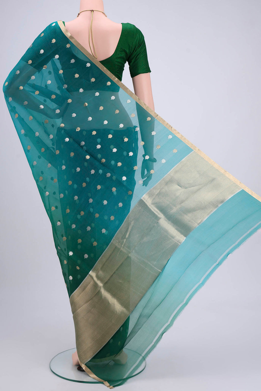 Flat view of Blue Organza Silk Saree with Half And Half on the body and Zari Border. 