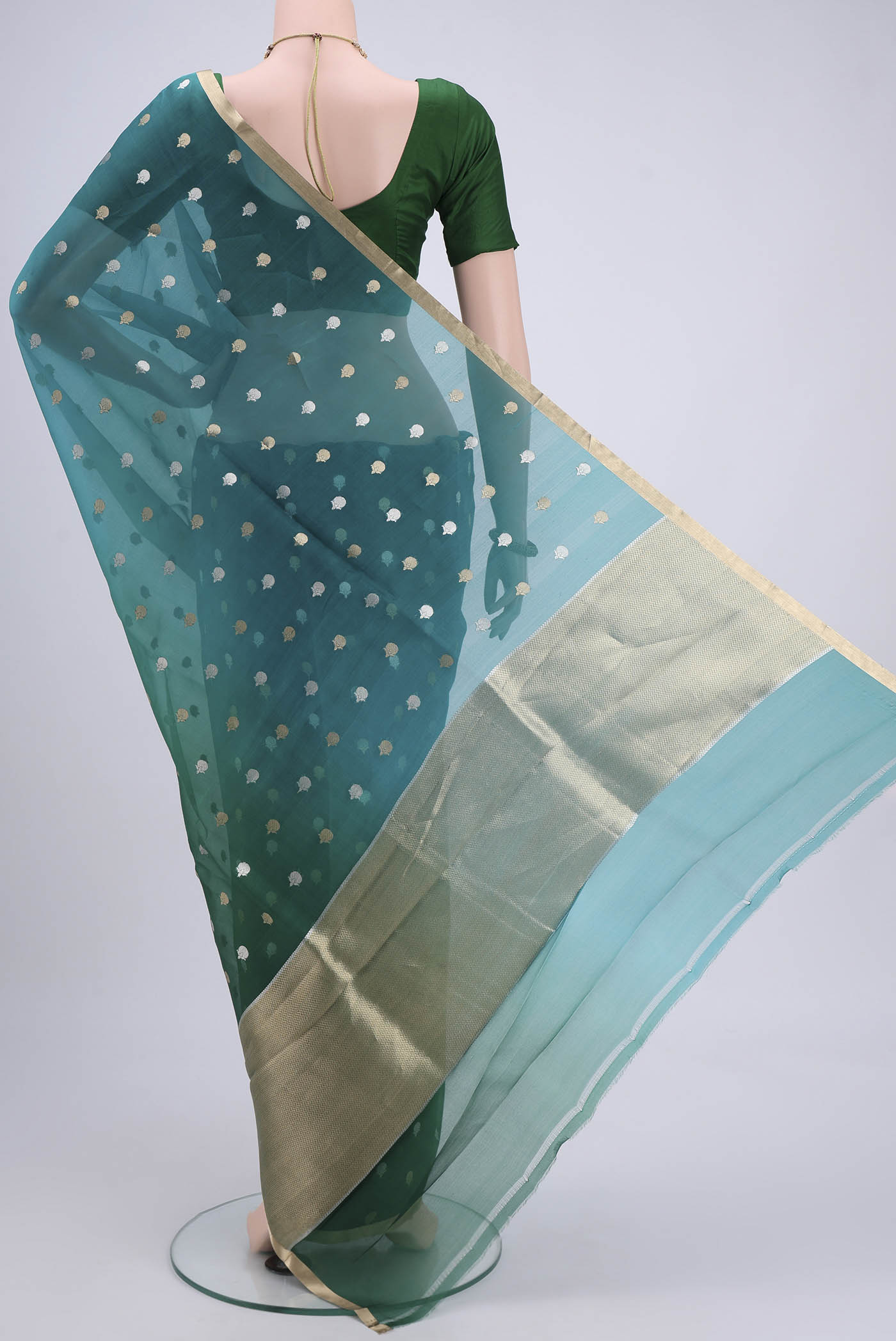 Flat view of Blue Organza Silk Saree with Half And Half on the body and Zari Border. 
