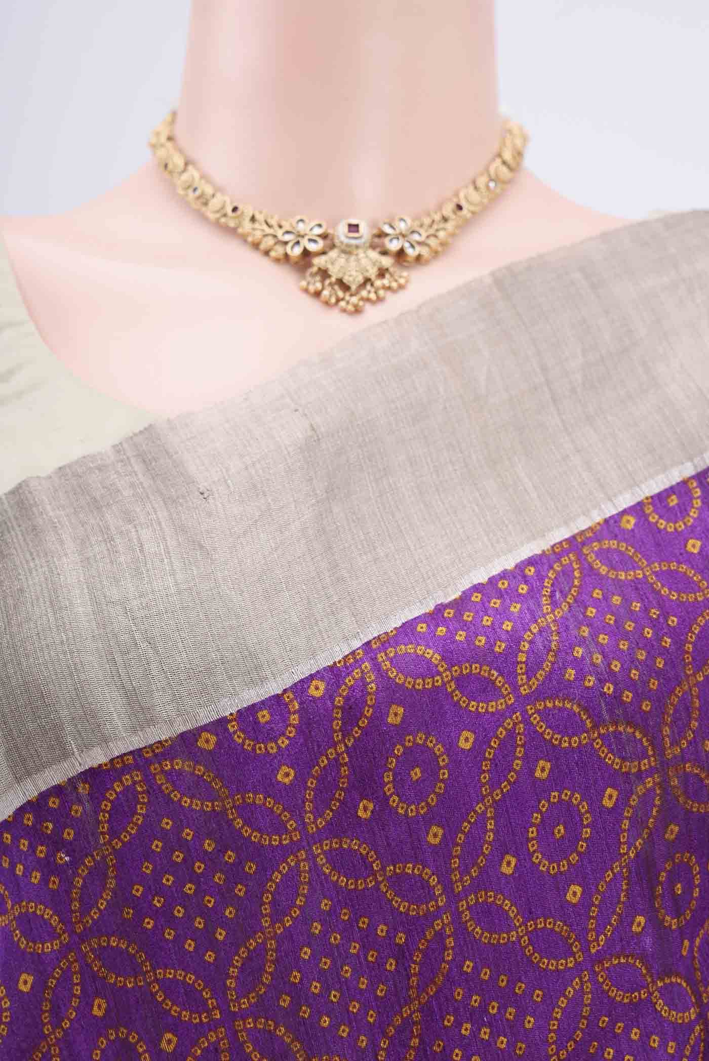 Border image of Purple Tussar Silk Saree with Bandhani Print on the body and Zari Border. 