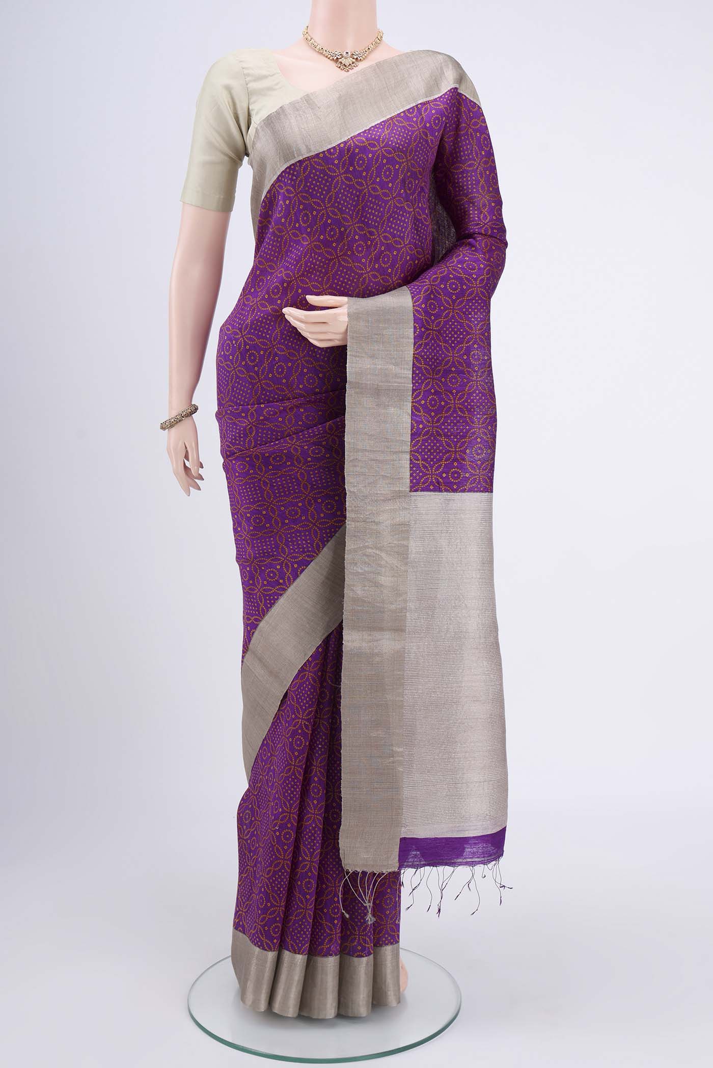 Purple Tussar Silk Saree with Bandhani Print on the body and Zari Border.  displayed on a mannequin
