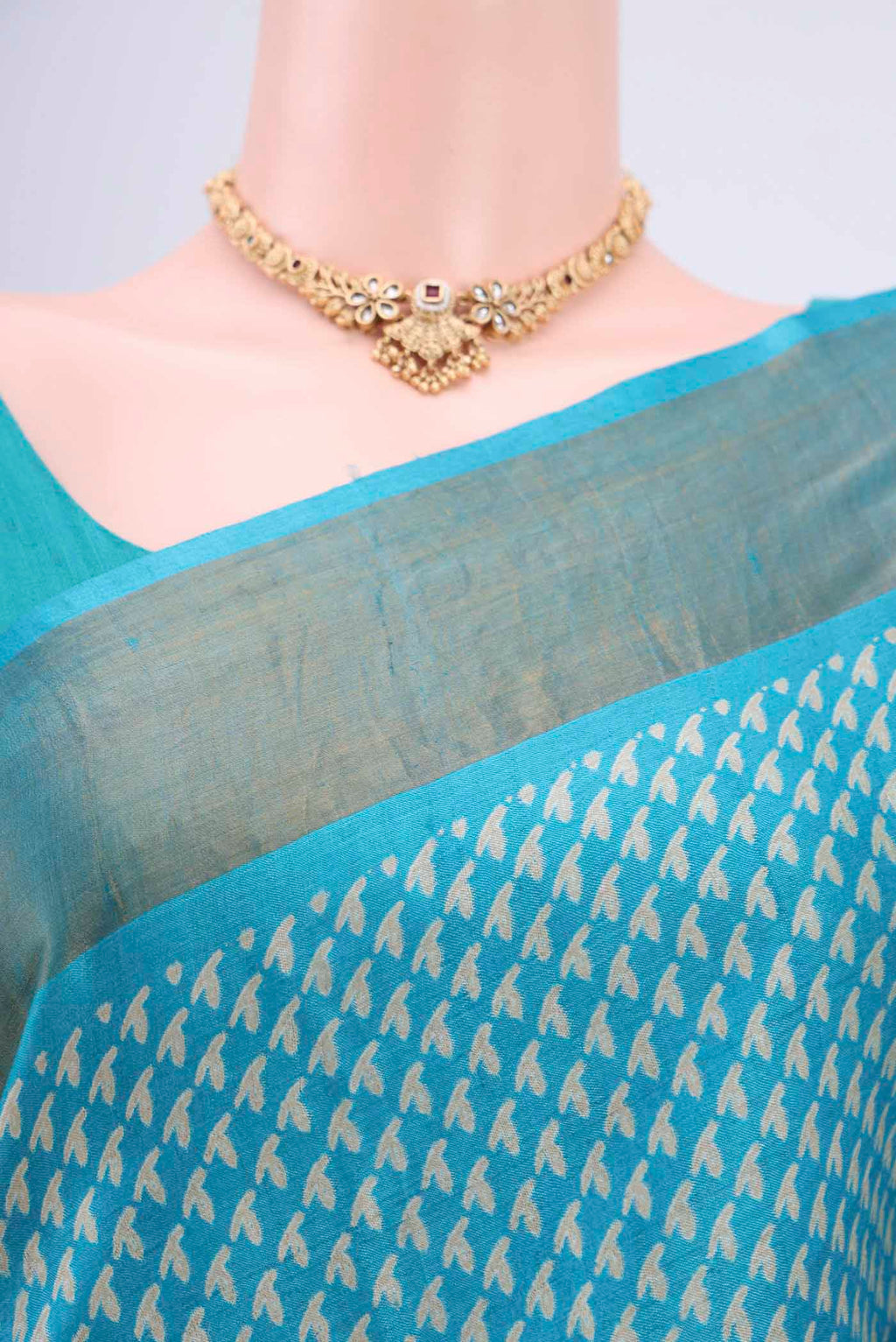 Border image of Turquoise Tussar Silk Saree with Printed design on the body and Zari Border. 