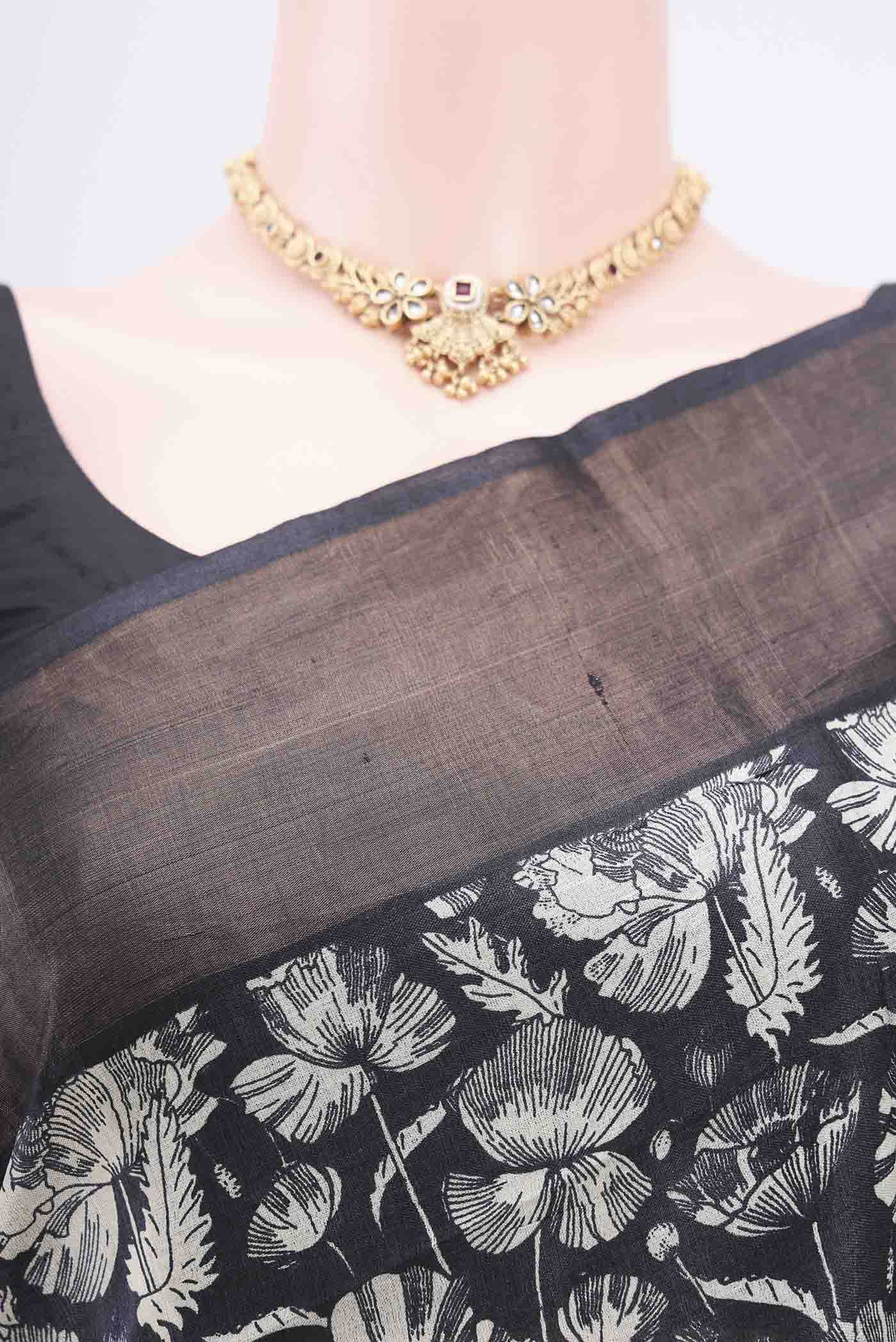 Border image of Black Printed Silk Saree with Floral Print on the body and Zari Border. 