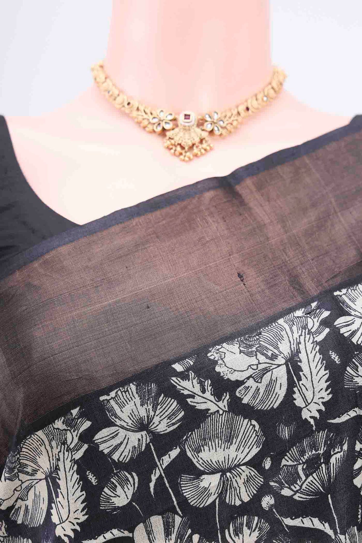 Border image of Black Printed Silk Saree with Floral Print on the body and Zari Border. 