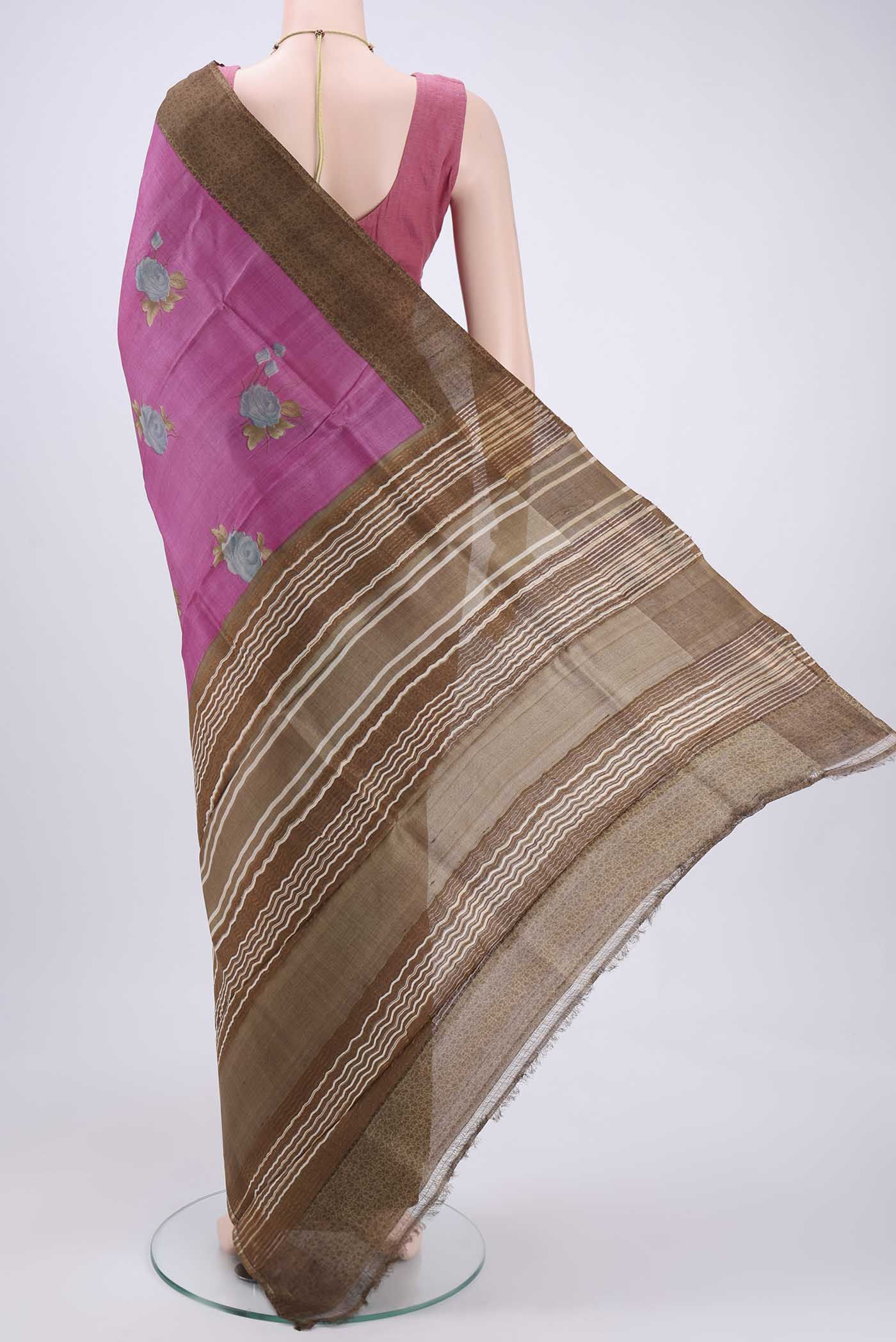 Flat view of Pink Printed Silk Saree with Floral Print on the body and Zari Border. 