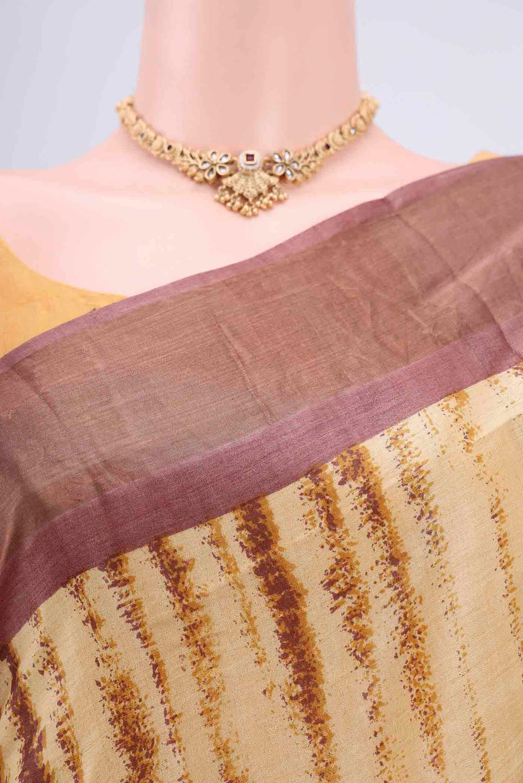 Border image of Cream Tussar Silk Saree with Printed design on the body and Zari Border. 