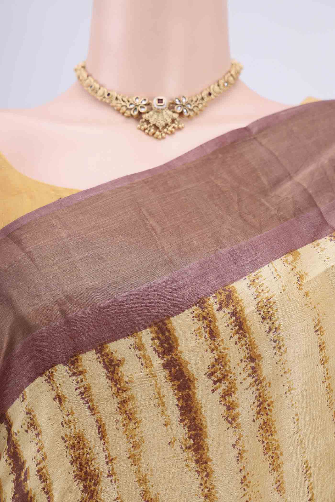 Border image of Cream Tussar Silk Saree with Printed design on the body and Zari Border. 
