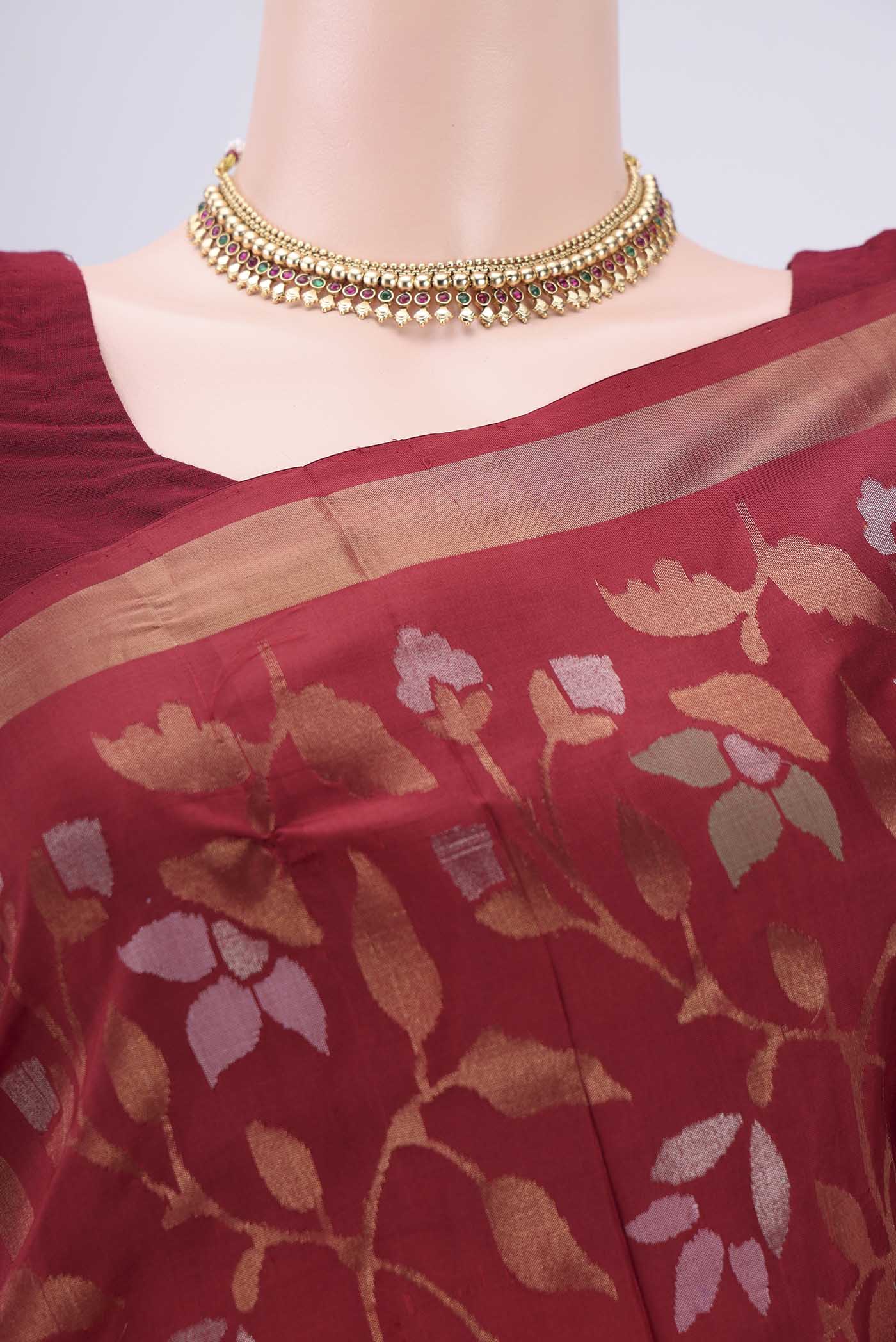 Border image of Maroon Uppada Silk Saree with Jamdani on the body and Zari Border. 