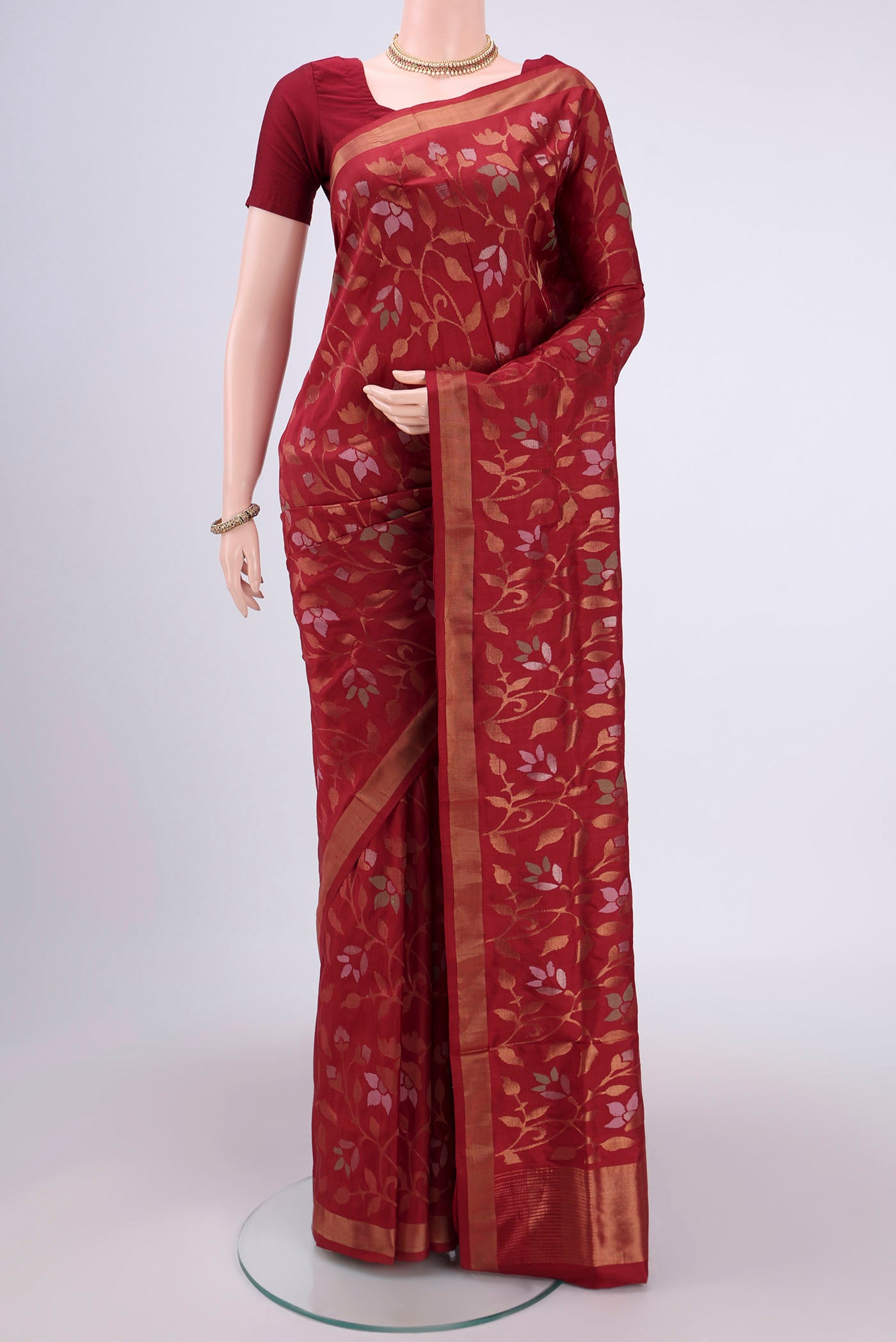Maroon Uppada Silk Saree with Jamdani on the body and Zari Border.  displayed on a mannequin
