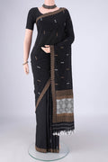 Black Assam Cotton Saree with Thread Butta on the body and Thread Border.  displayed on a mannequin