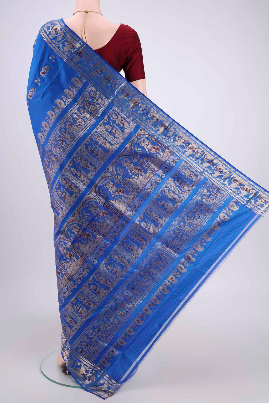 Flat view of Royal Blue Baluchari Silk Saree with Zari And Thread Butta on the body and Zari And Thread Border. 
