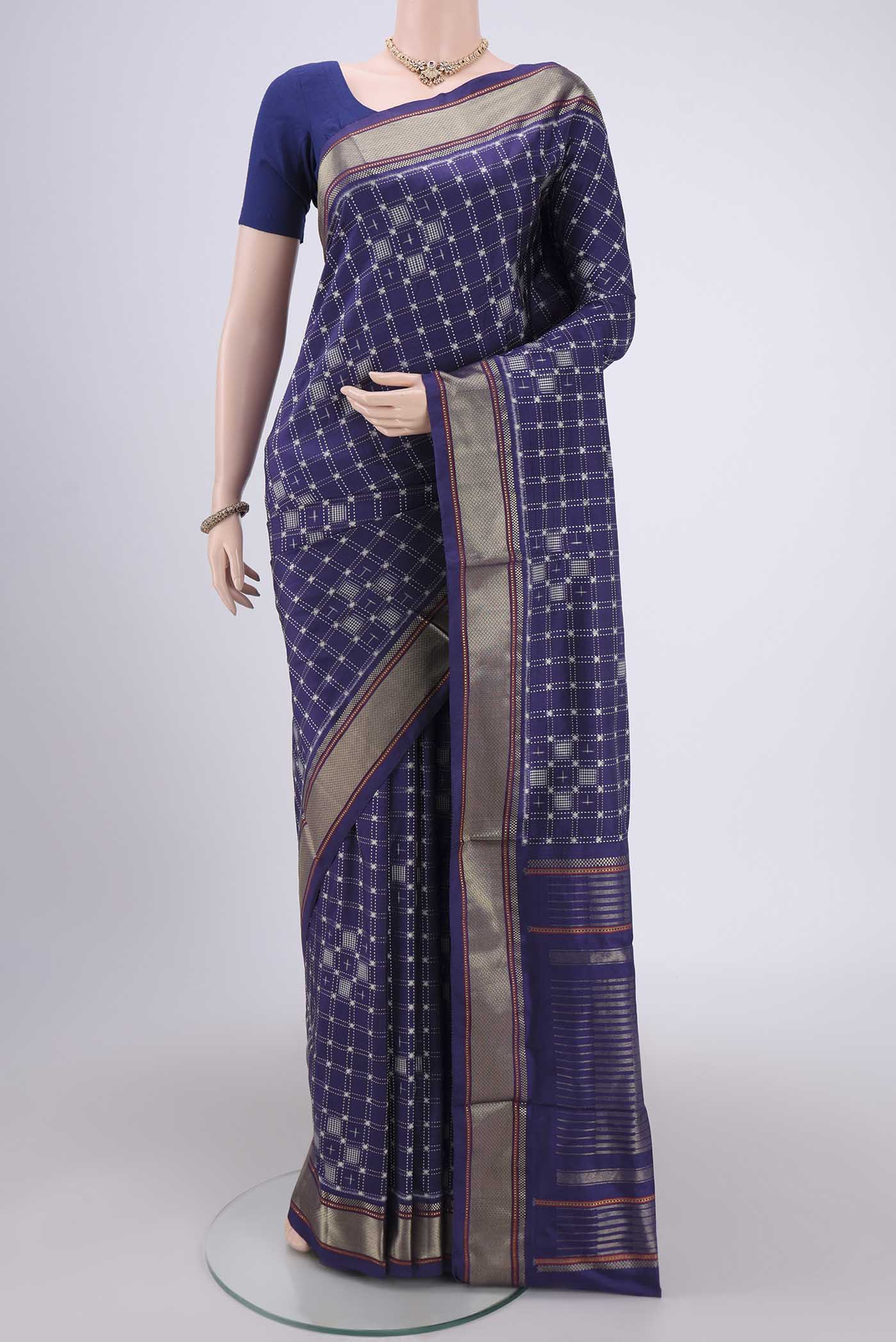 Purple Pochampally Silk Saree with Checked design on the body and Zari Border.  displayed on a mannequin