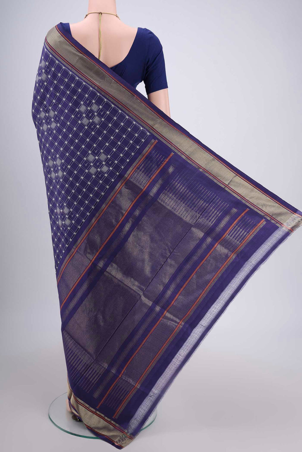 Flat view of Purple Pochampally Silk Saree with Checked design on the body and Zari Border. 