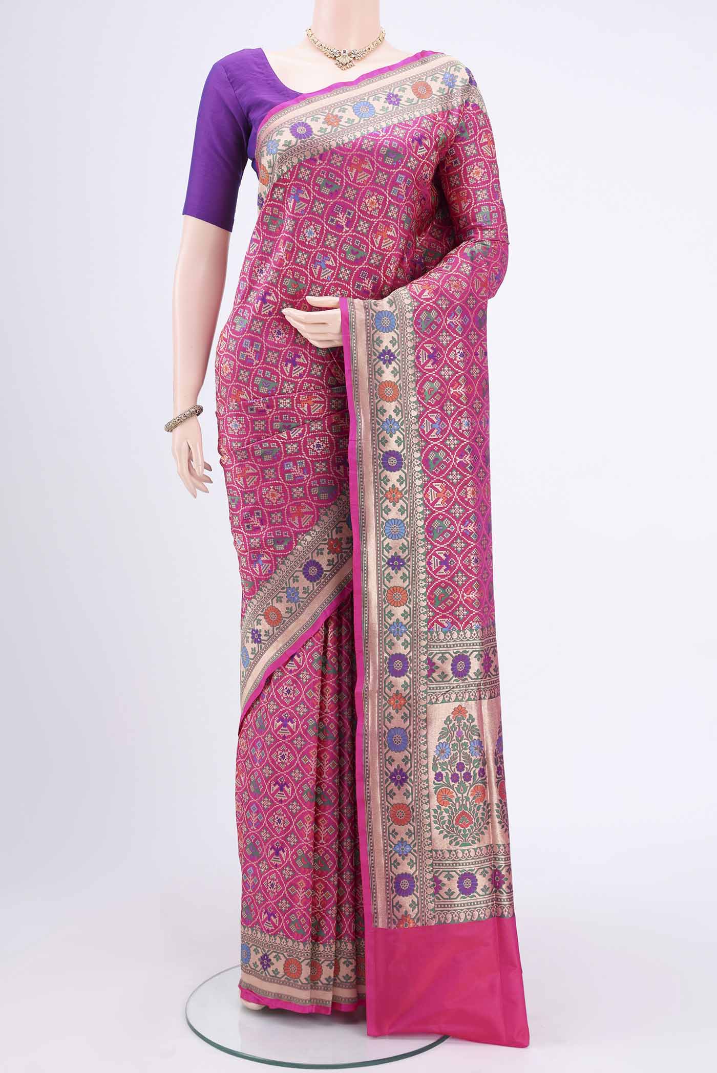 Rani Pink Banarasi Silk Saree with Jamdani on the body and Zari And Thread Border.  displayed on a mannequin