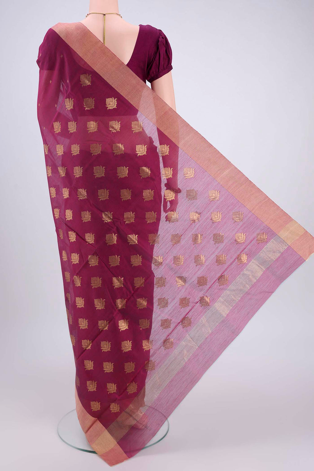 Flat view of Magenta Chanderi Silk Cotton Saree with Zari Butta on the body and Zari Border. 