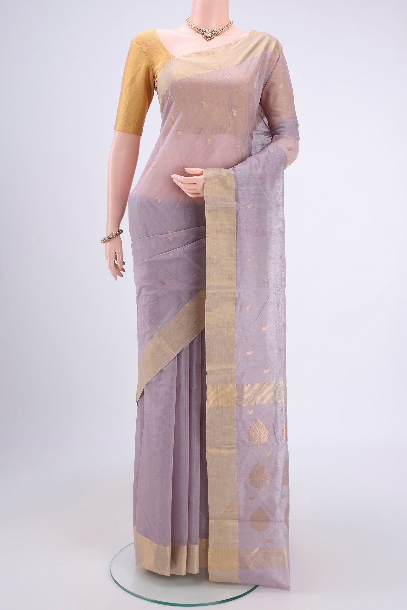 Grey Chanderi Silk Cotton Saree with Zari Butta on the body and Zari Border.  displayed on a mannequin