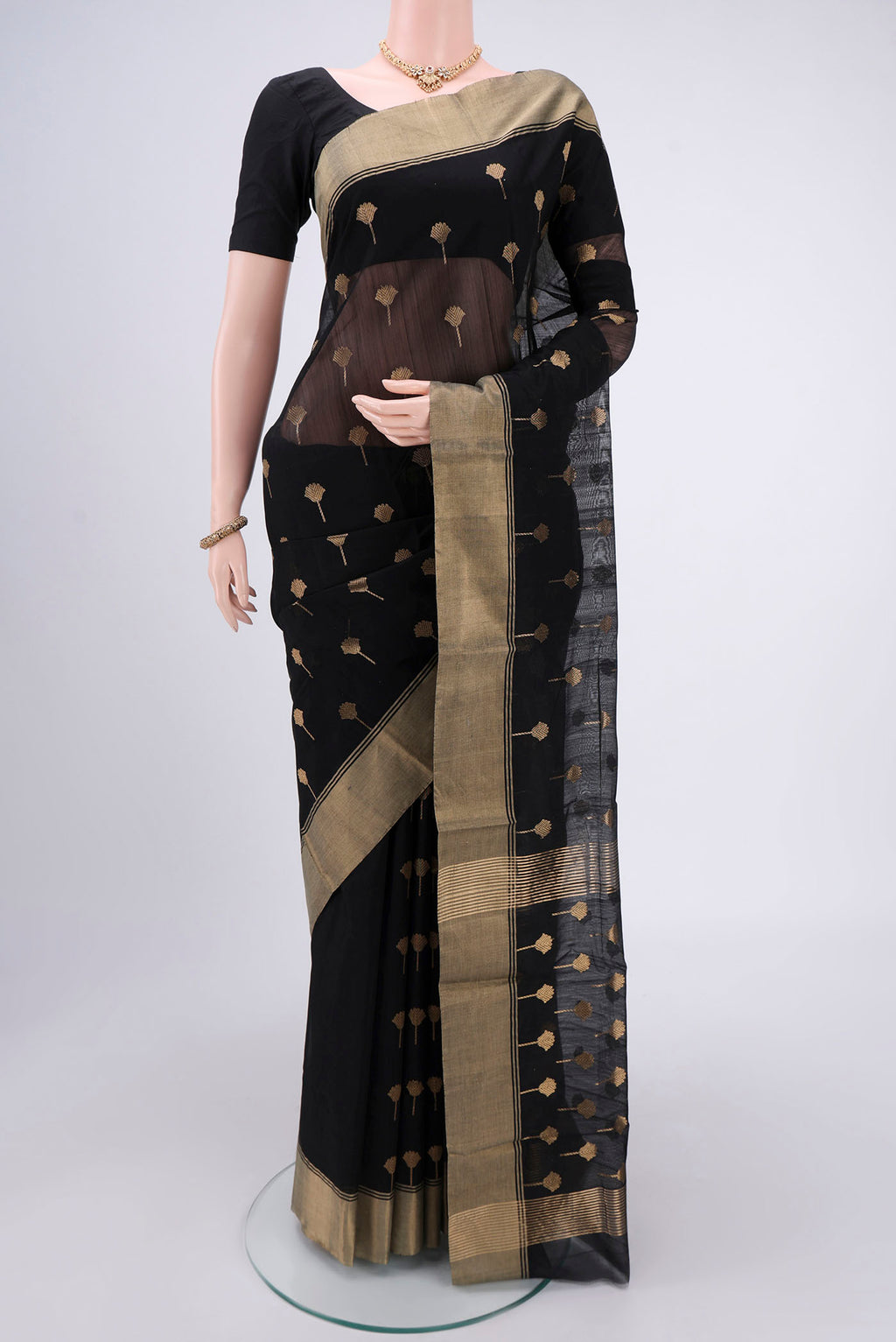 Black Chanderi Silk Cotton Saree with Zari Butta on the body and Zari Border.  displayed on a mannequin