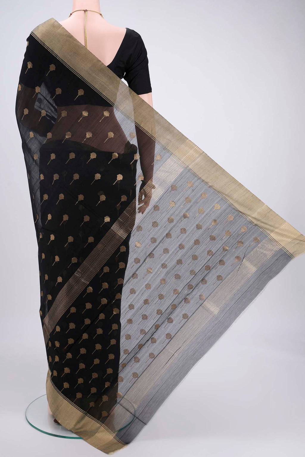 Flat view of Black Chanderi Silk Cotton Saree with Zari Butta on the body and Zari Border. 