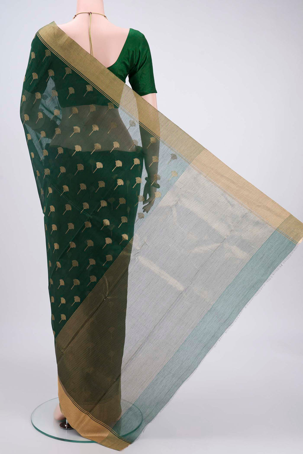 Flat view of Green Chanderi Silk Cotton Saree with Zari Butta on the body and Zari Border. 