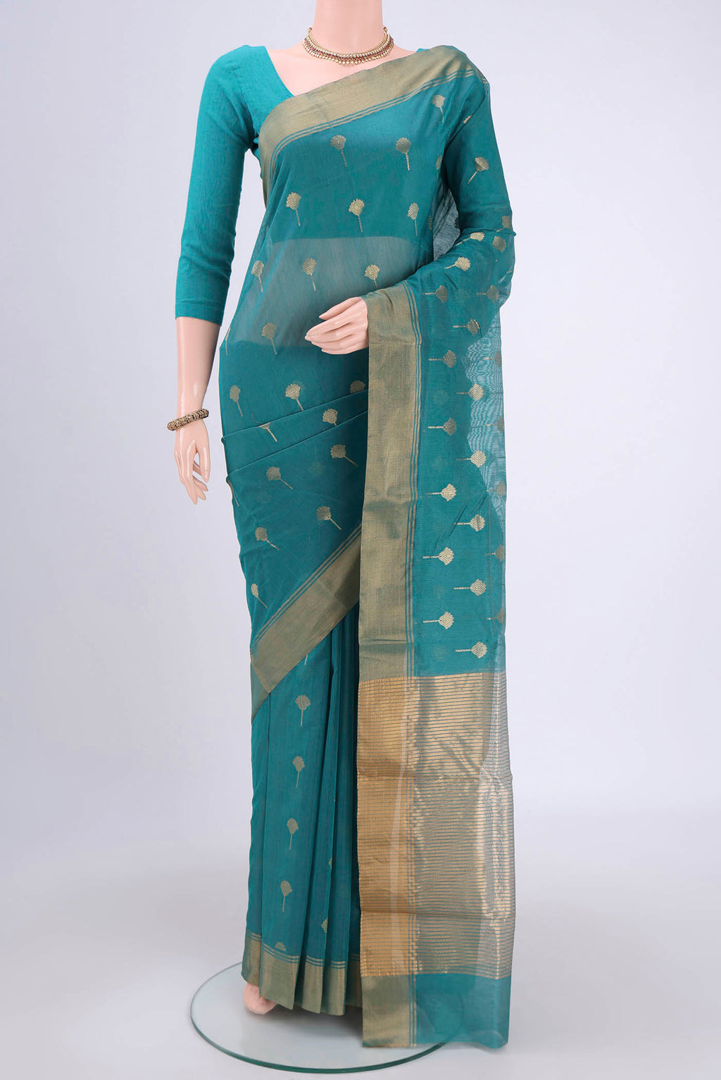 Maya Blue Chanderi Silk Cotton Saree with Zari Butta on the body and Zari Border.  displayed on a mannequin
