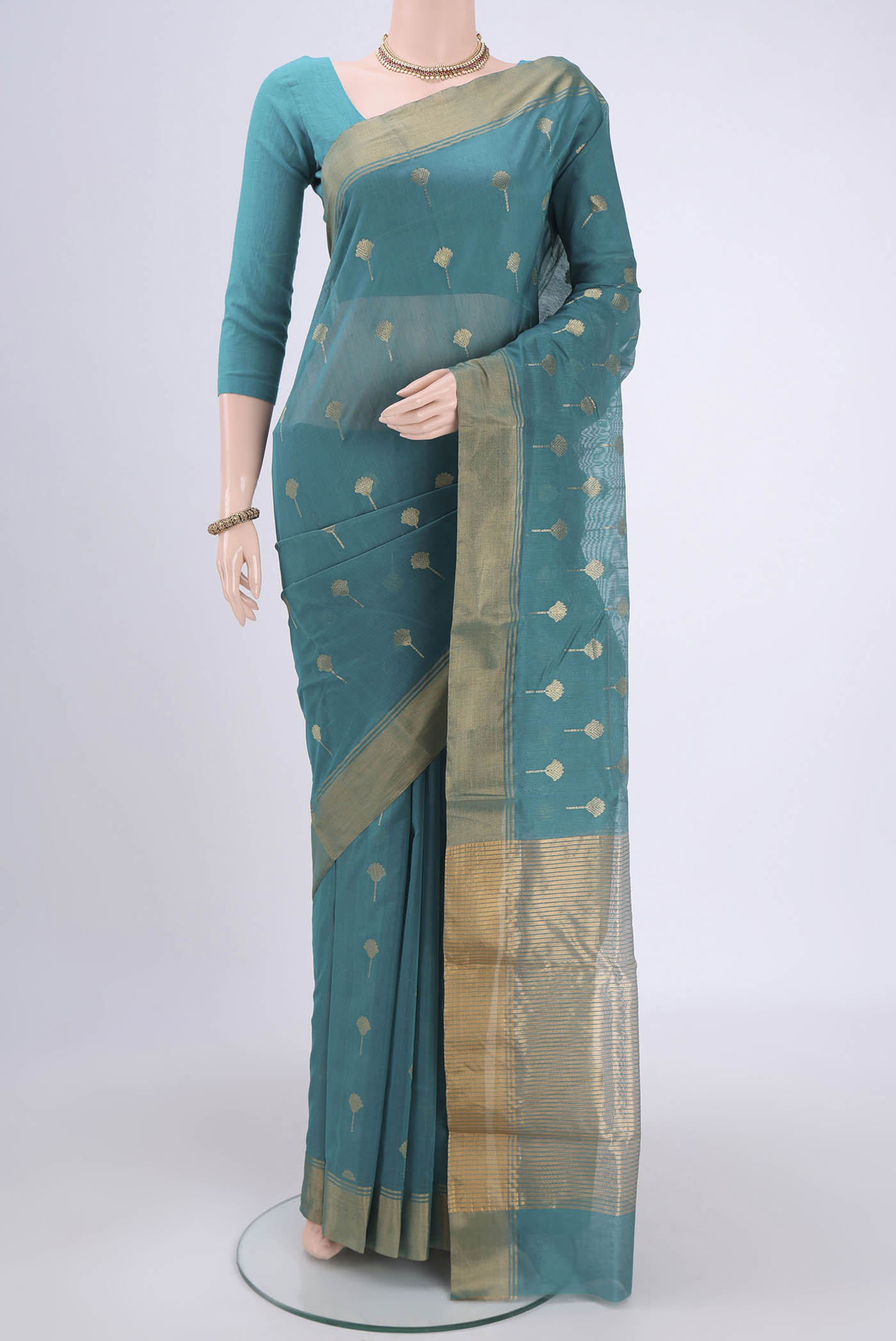 Maya Blue Chanderi Silk Cotton Saree with Zari Butta on the body and Zari Border.  displayed on a mannequin