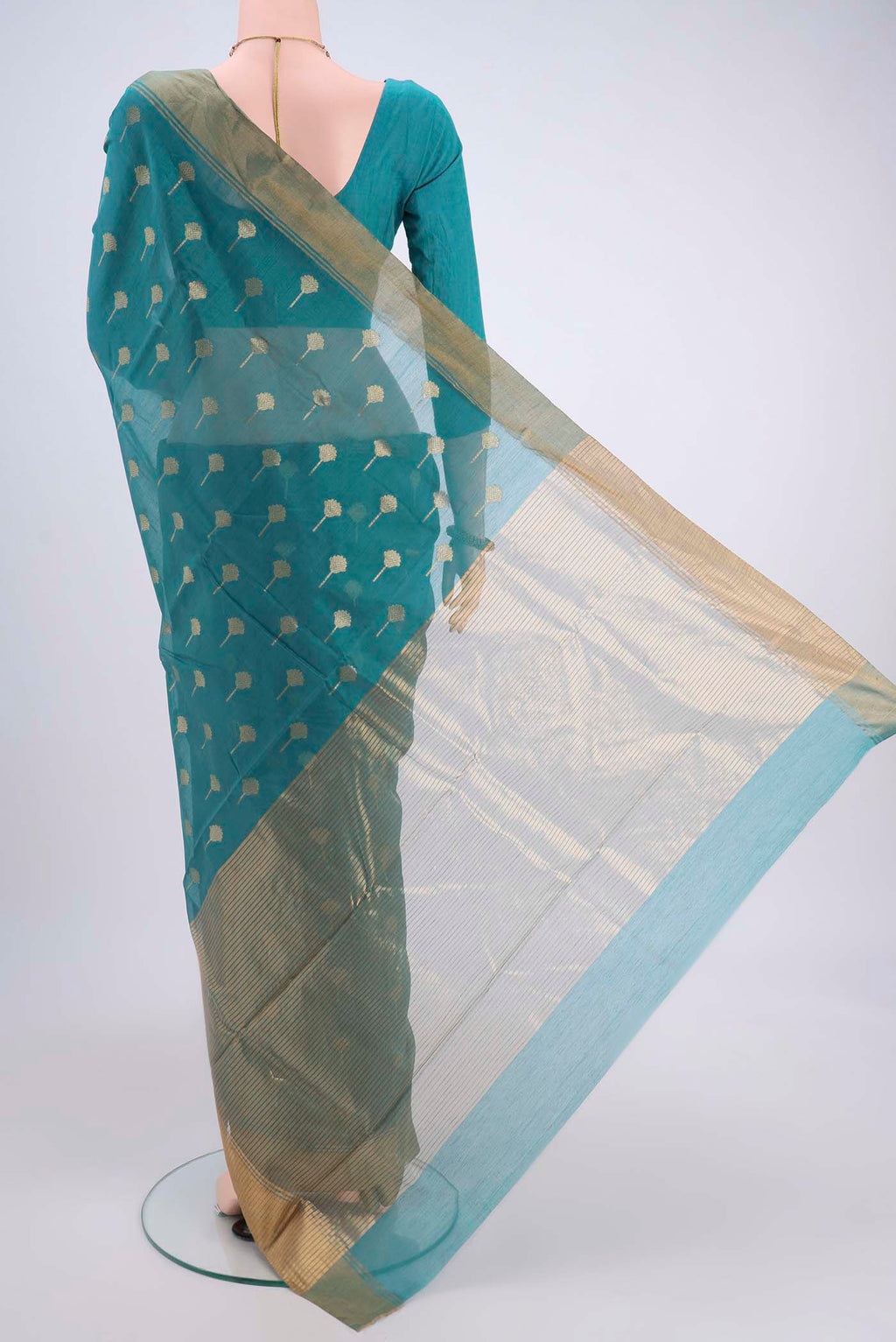 Flat view of Maya Blue Chanderi Silk Cotton Saree with Zari Butta on the body and Zari Border. 