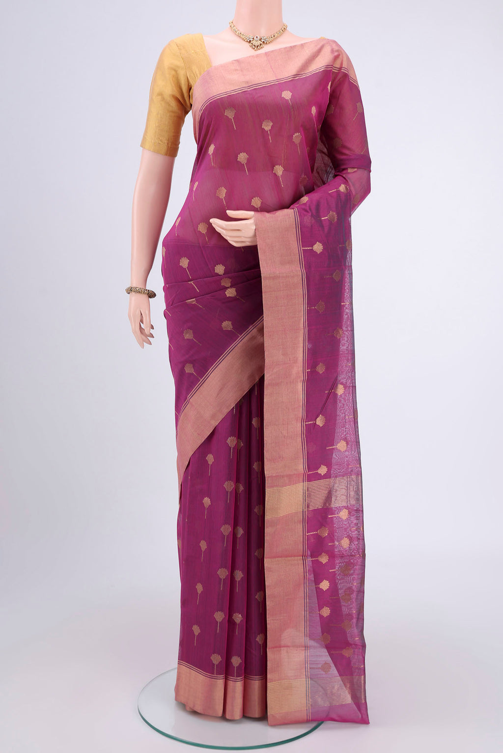 Magenta Chanderi Silk Cotton Saree with Zari Butta on the body and Zari Border.  displayed on a mannequin