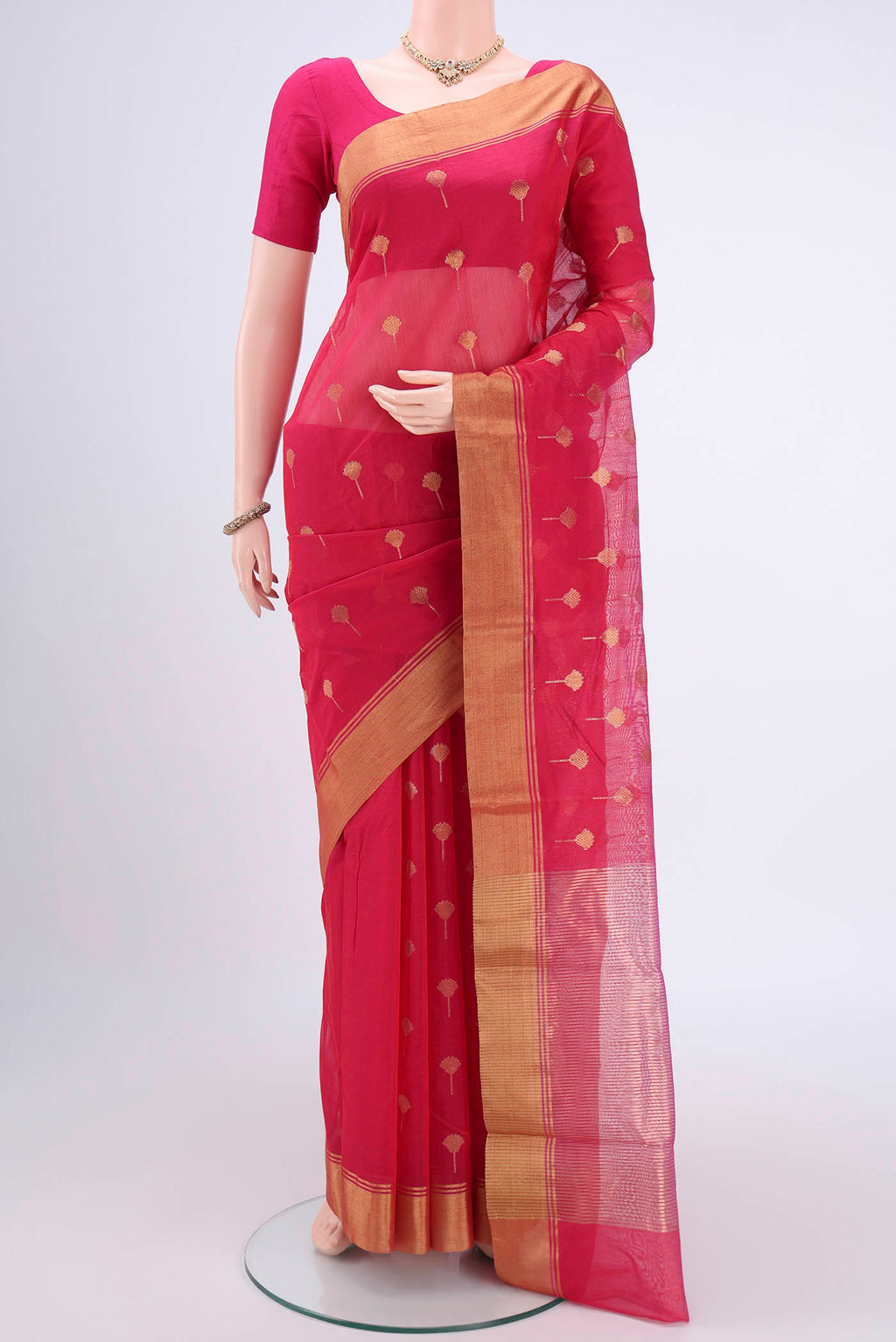 Rani Pink Chanderi Silk Cotton Saree with Zari Butta on the body and Zari Border.  displayed on a mannequin