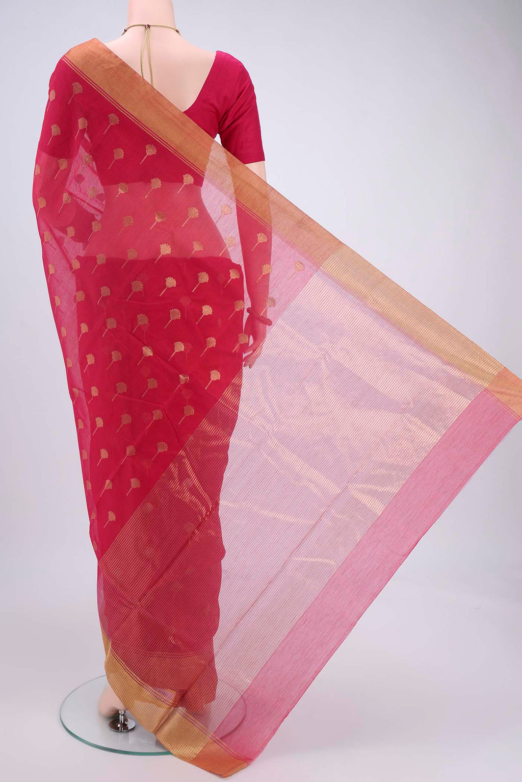 Flat view of Rani Pink Chanderi Silk Cotton Saree with Zari Butta on the body and Zari Border. 