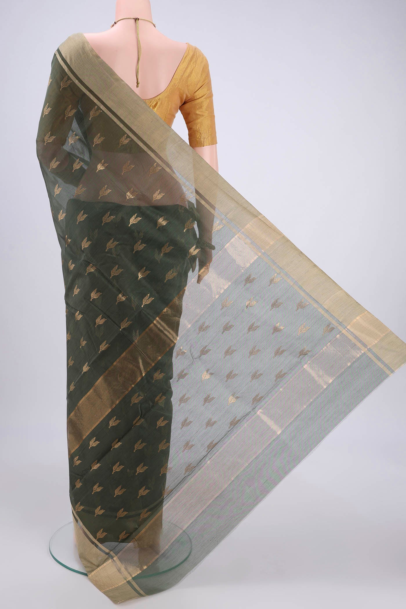 Flat view of Sage Green Chanderi Silk Cotton Saree with Zari Butta on the body and Zari Border. 