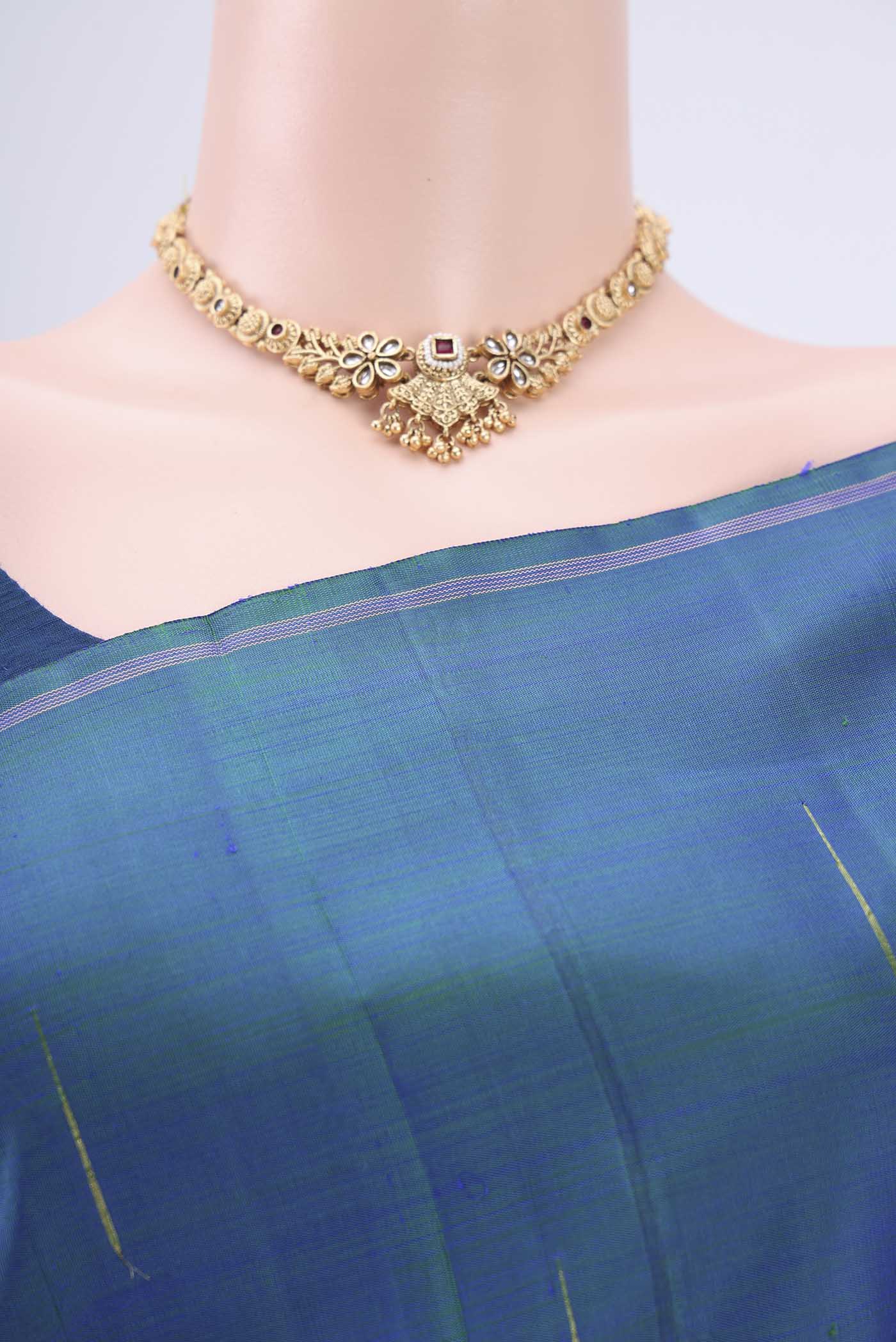 Border image of Pure Silk Pure Zari Peacock Blue Dual Tone Kanjivaram Saree with Zari Butta on the body and Zari Border. 