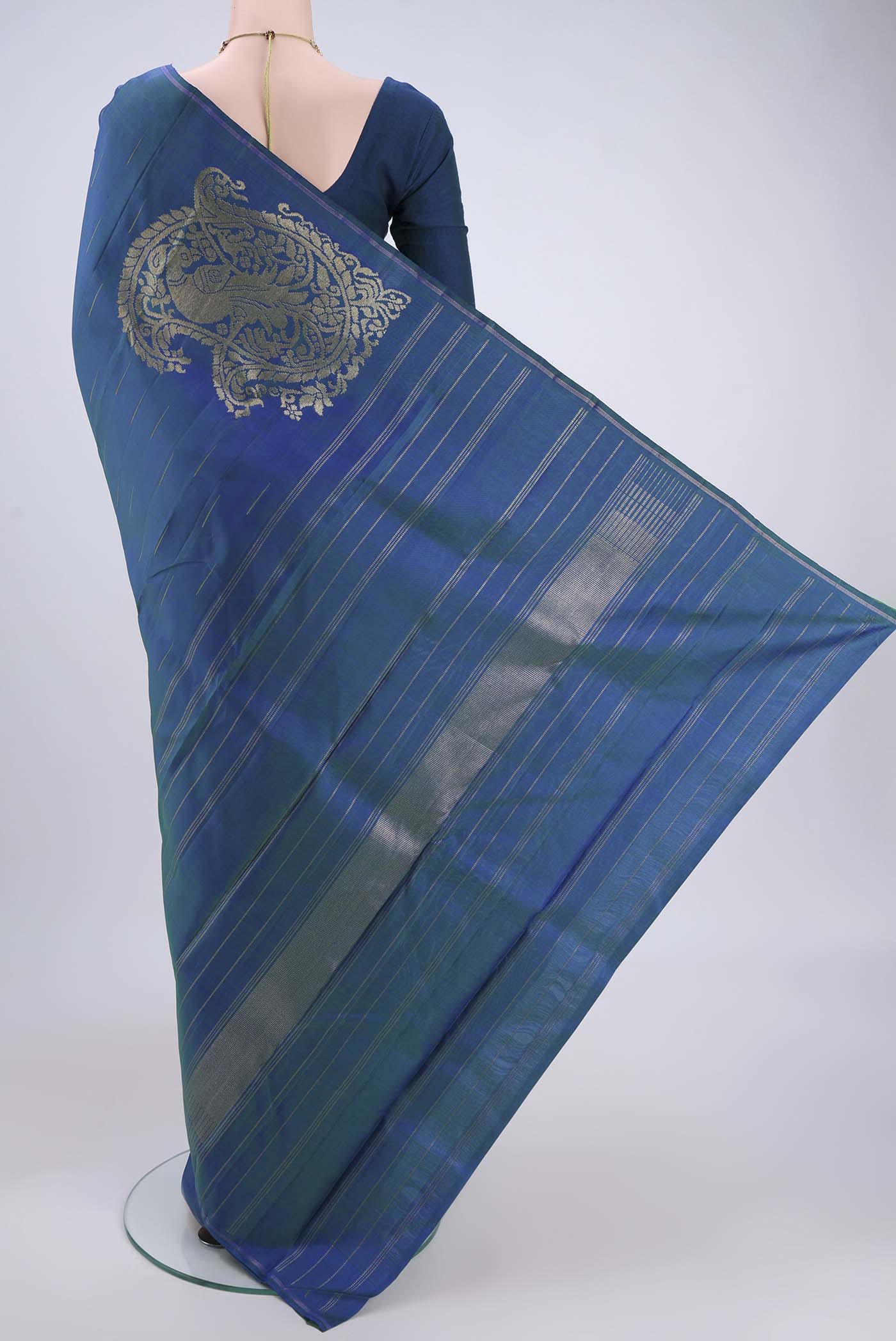 Flat view of Pure Silk Pure Zari Peacock Blue Dual Tone Kanjivaram Saree with Zari Butta on the body and Zari Border. 
