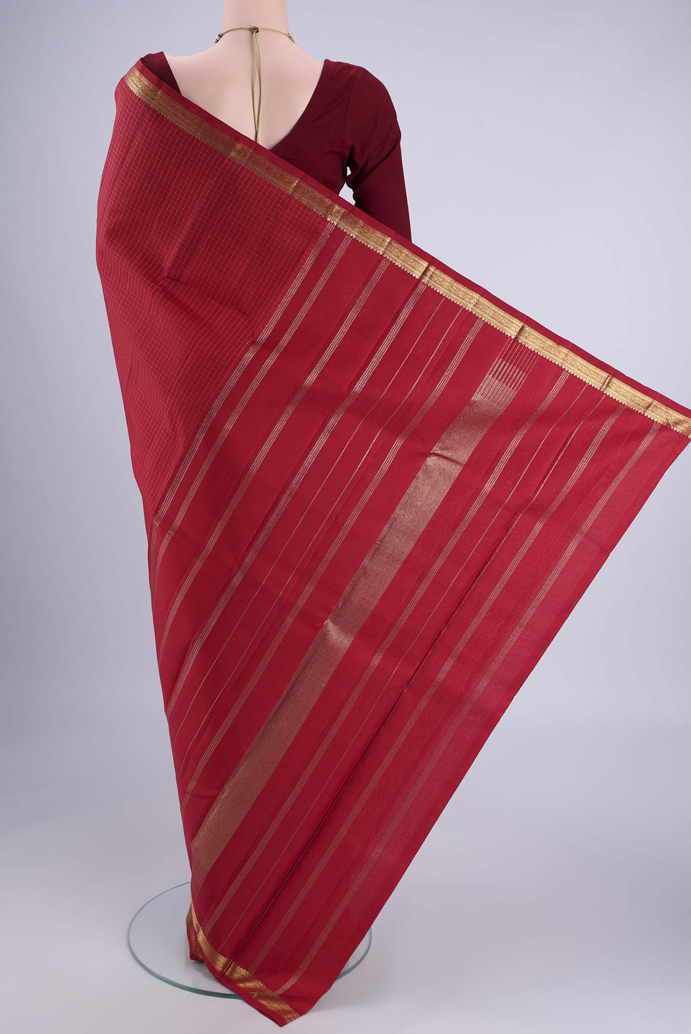 Flat view of Maroon Kanjivaram Silk Saree with Checked design on the body and Zari Border. 