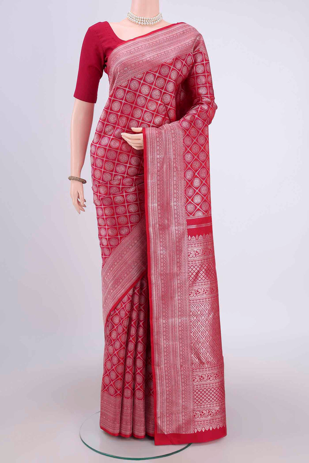 Dark Pink Kanchipuram Silk Saree with Zari Brocade on the body and Zari Border.  displayed on a mannequin