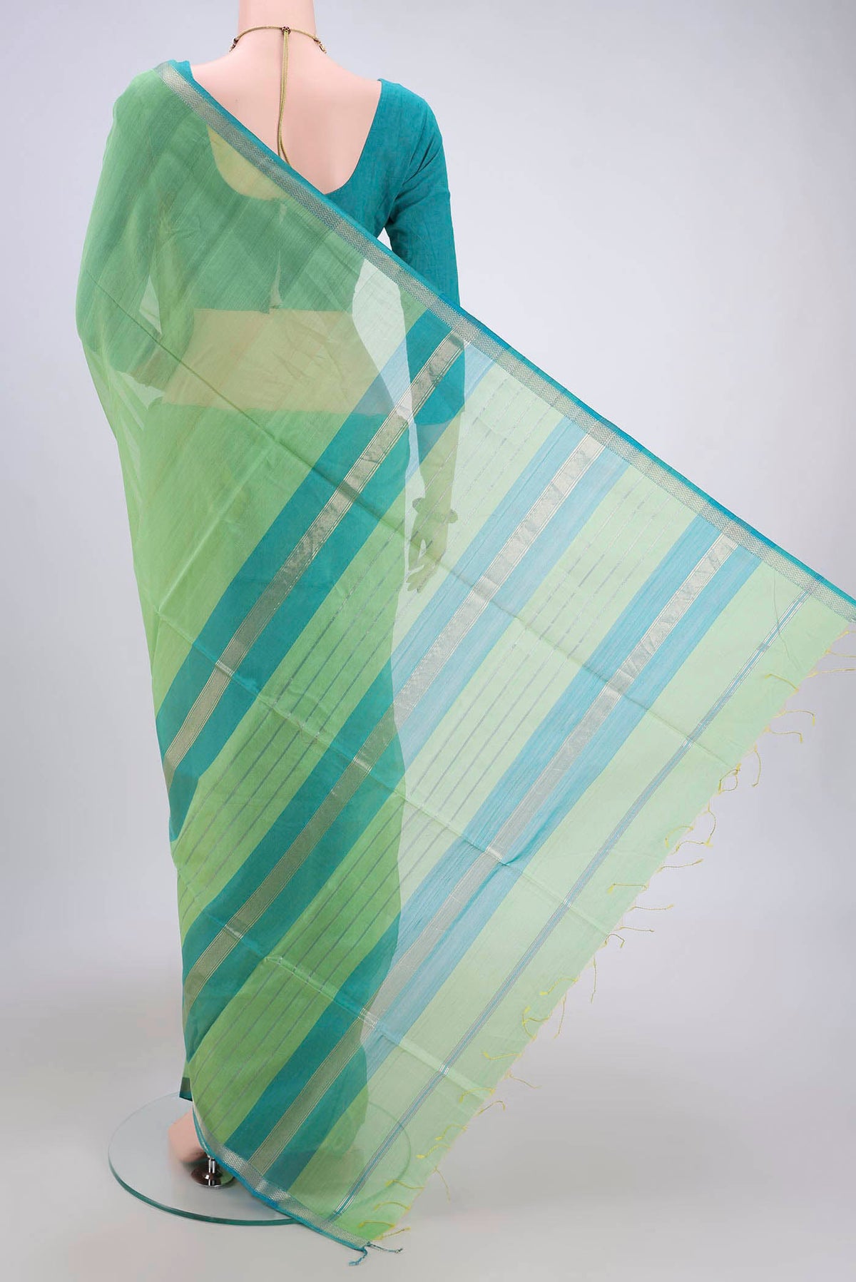 Flat view of Acid Green Maheshwari Silk Cotton Saree with Plain Body and Zari Border. 
